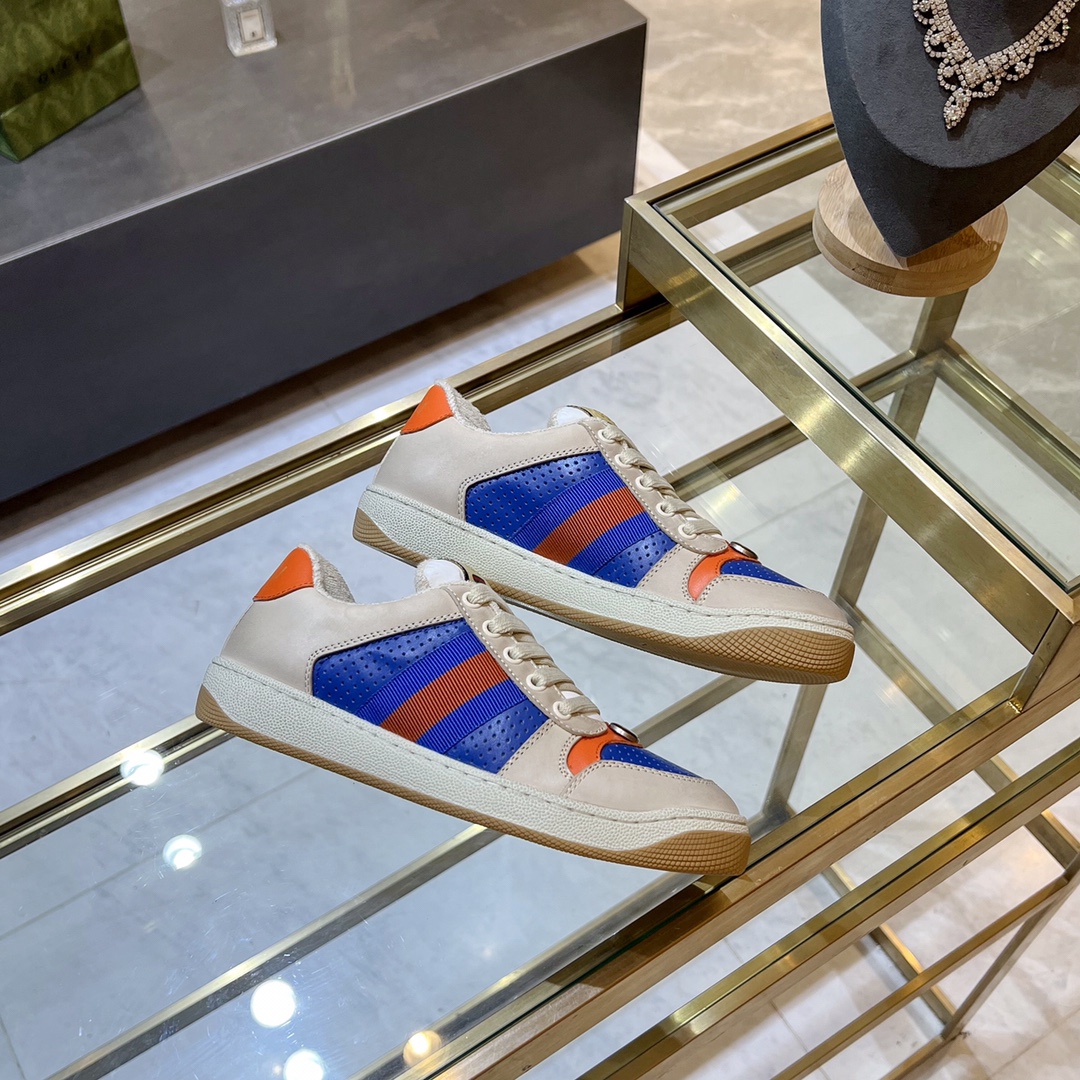 ex fábrica Gucci. zapatitos sucios piel perforada naranja y verde cinchas rojas y azules detalle pie