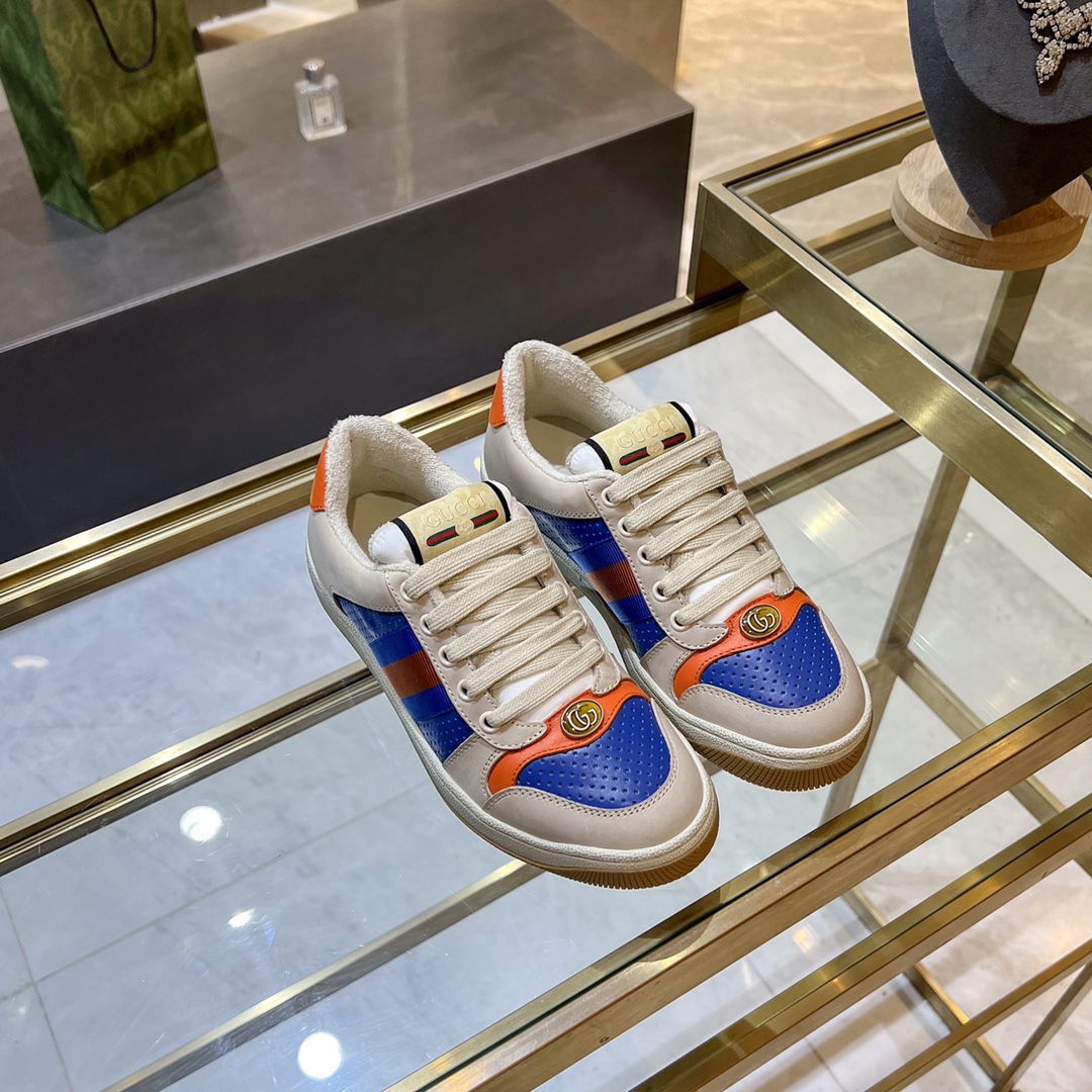 ex fábrica Gucci. zapatitos sucios piel perforada naranja y verde cinchas rojas y azules detalle pie