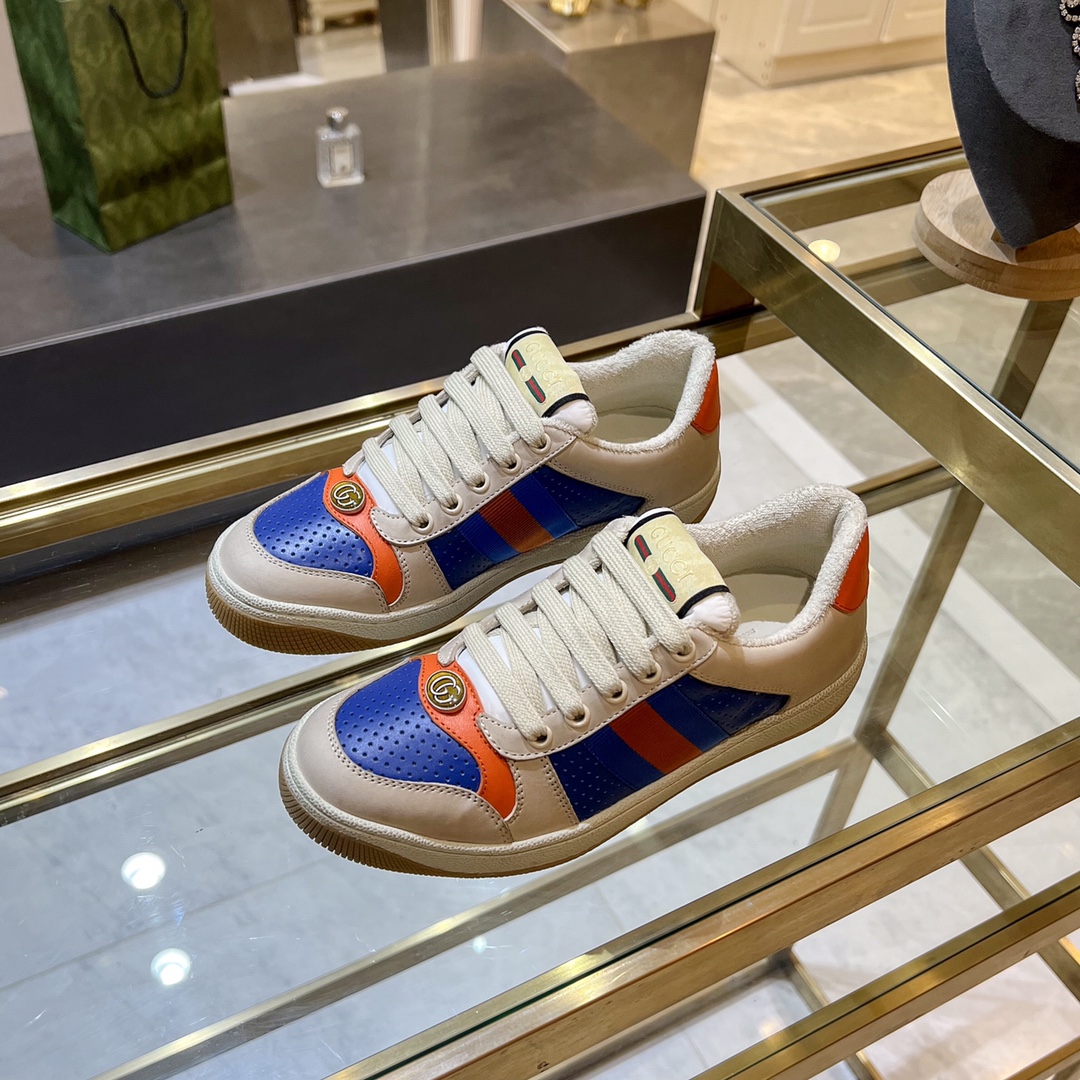 ex fábrica Gucci. zapatitos sucios piel perforada naranja y verde cinchas rojas y azules detalle pie
