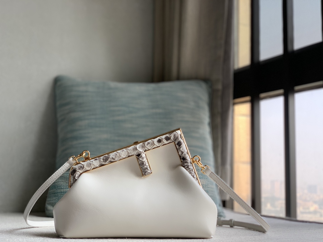 Fendi First Fendi python small handbag, made of lambskin, decorated with an oversized F metal buckle, covered with luxurious python skin of the s