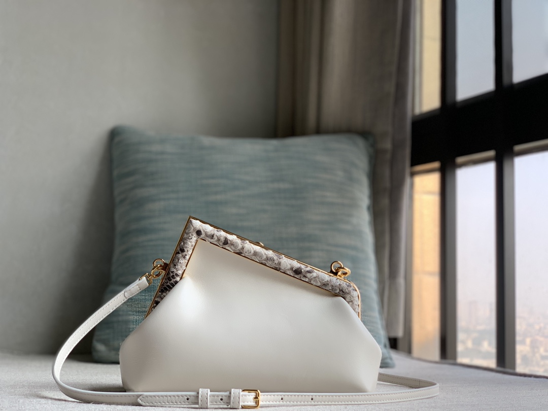 Fendi First Fendi python small handbag, made of lambskin, decorated with an oversized F metal buckle, covered with luxurious python skin of the s
