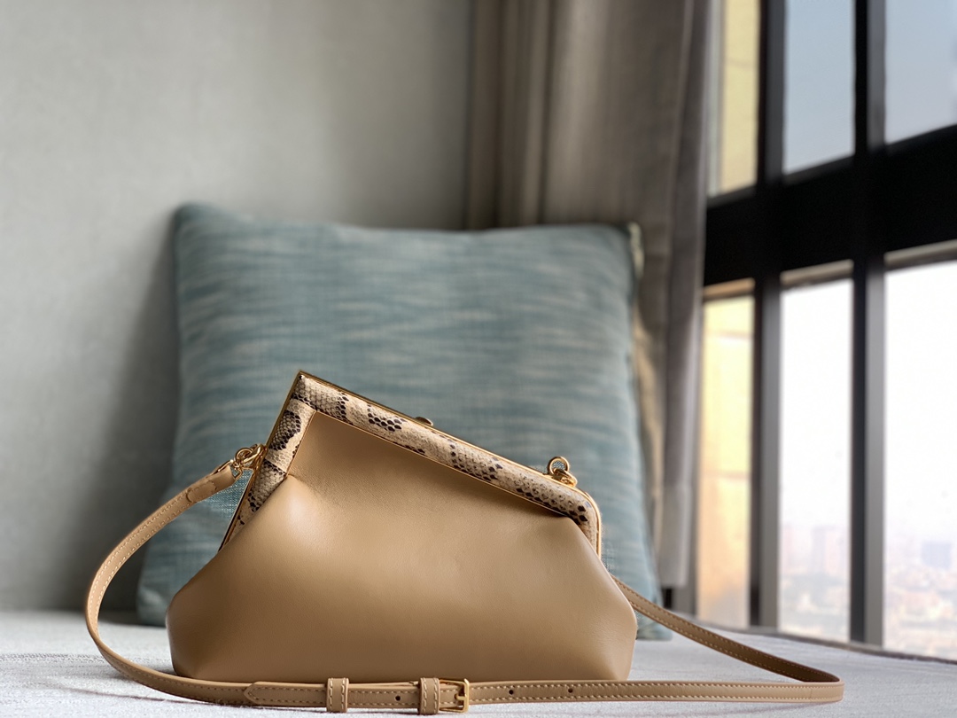 Fendi First Fendi python small handbag, made of lambskin, decorated with an oversized F metal buckle, covered with luxurious python skin of the s