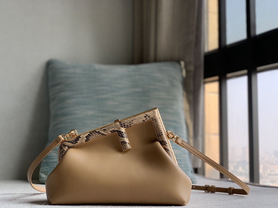 Fendi First Fendi python small handbag, made of lambskin, decorated with an oversized F metal buckle, covered with luxurious python skin of the s