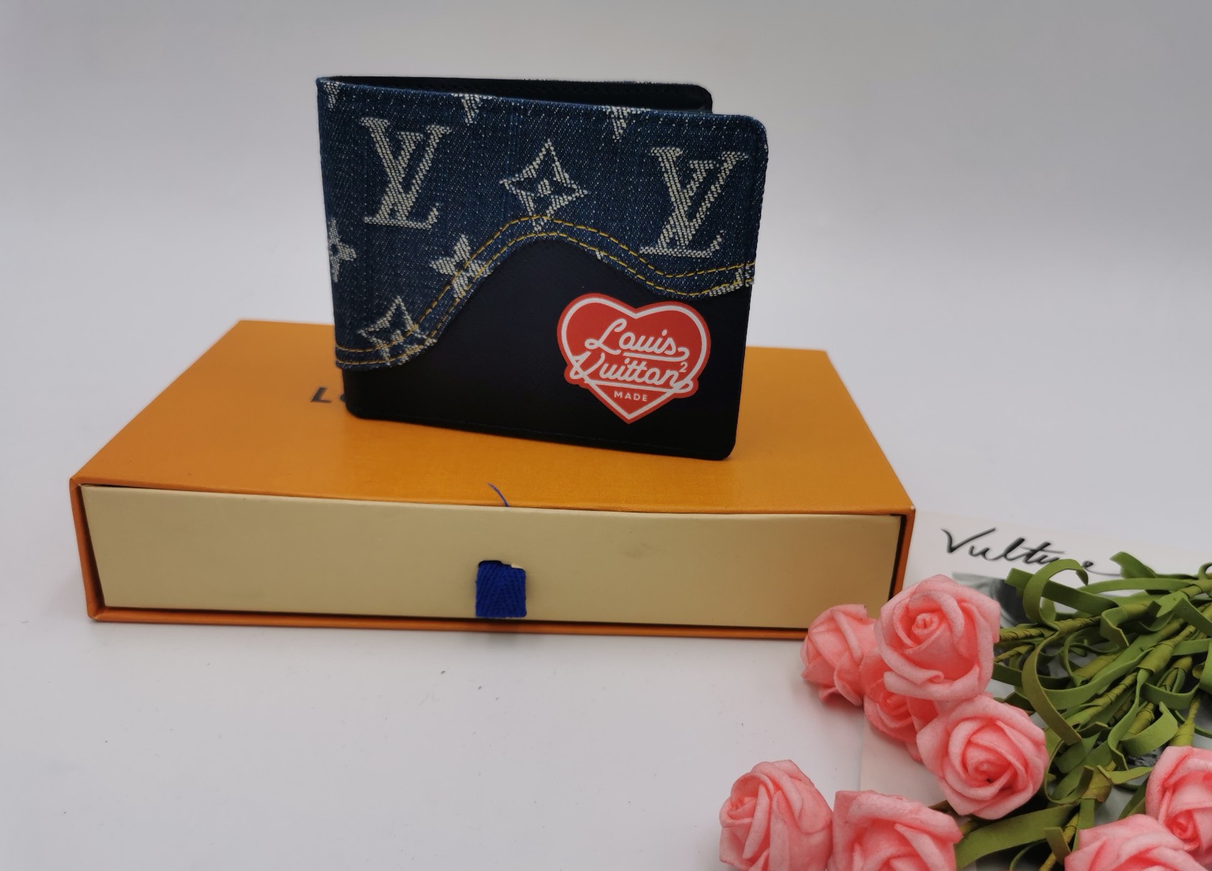 Front view of a luxury leather bifold wallet.