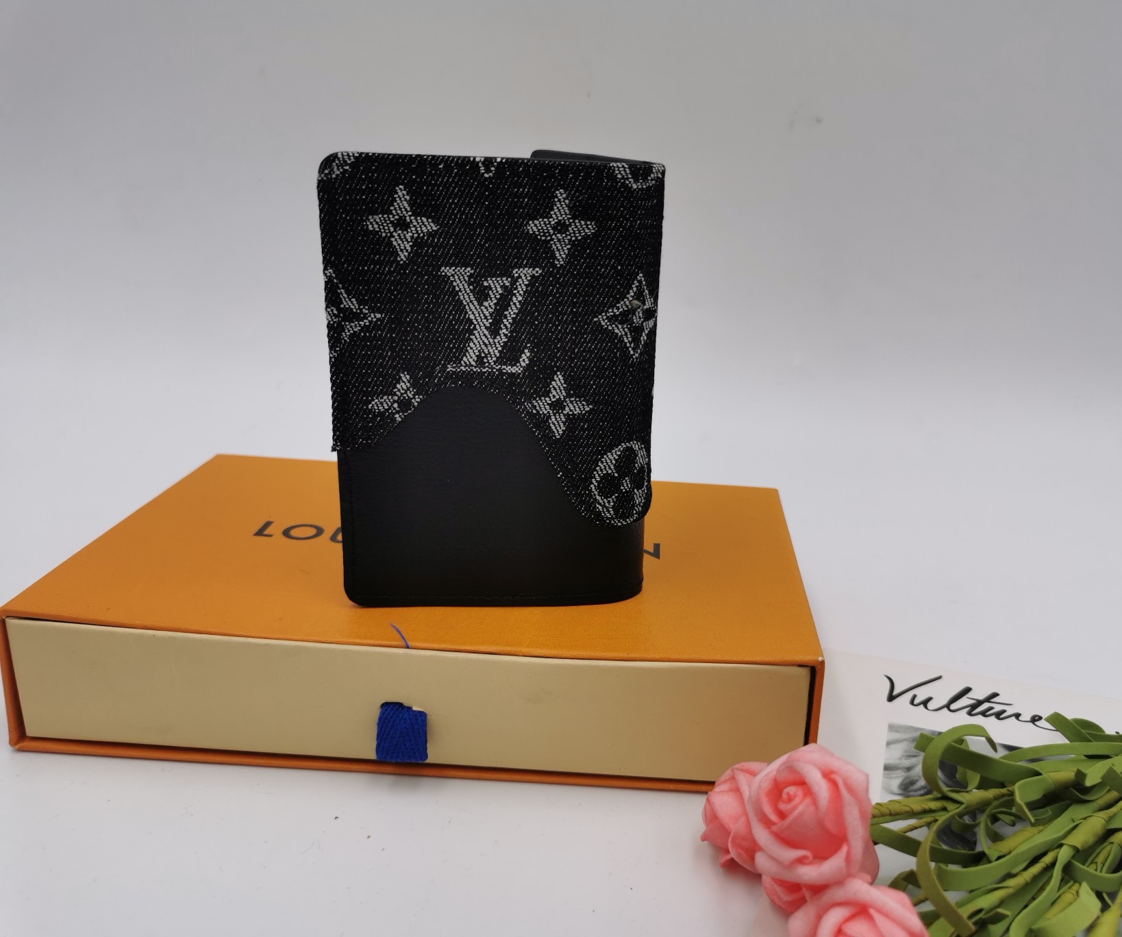 Leather card holder in use, holding cards