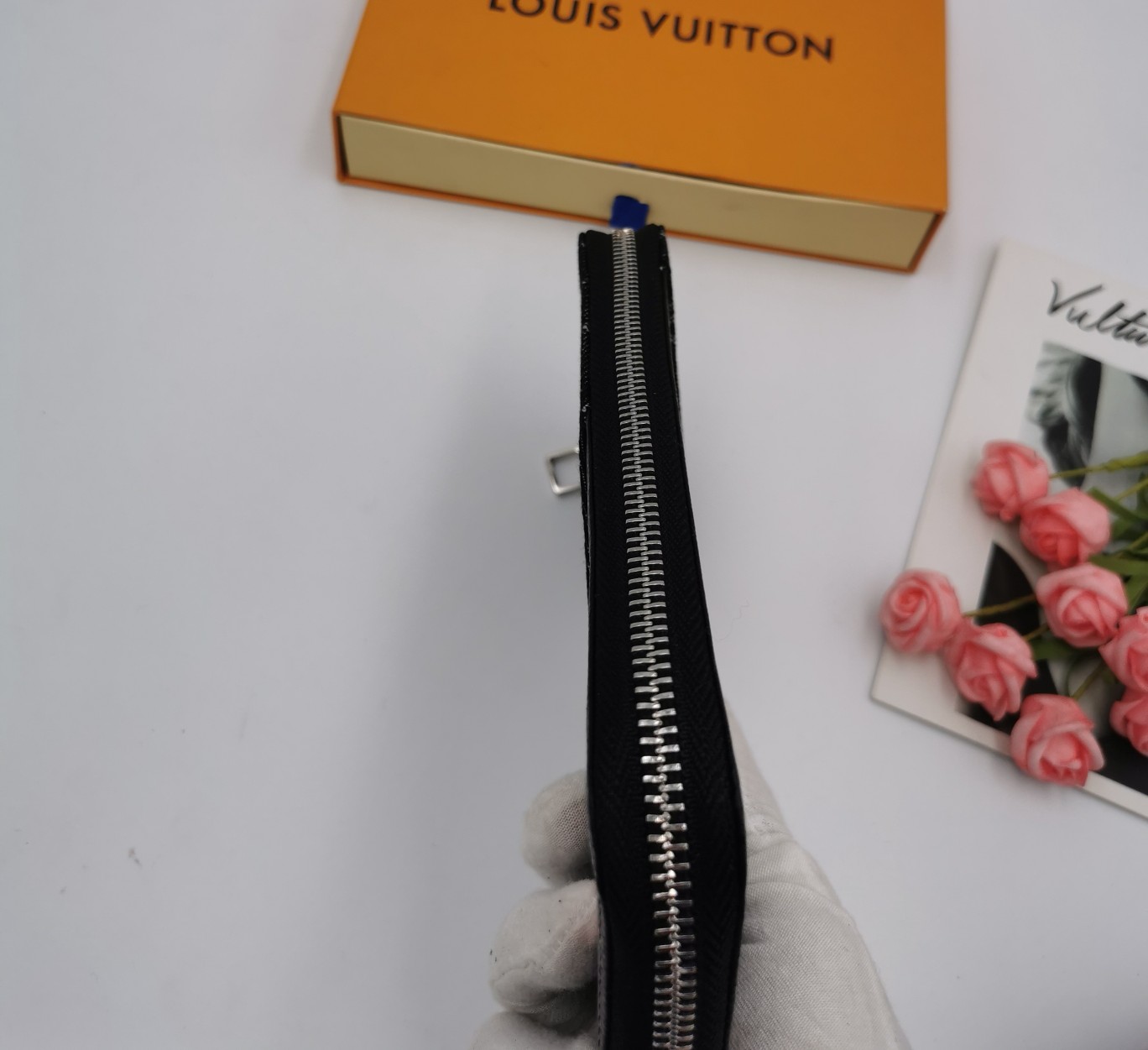 Person holding leather wallet