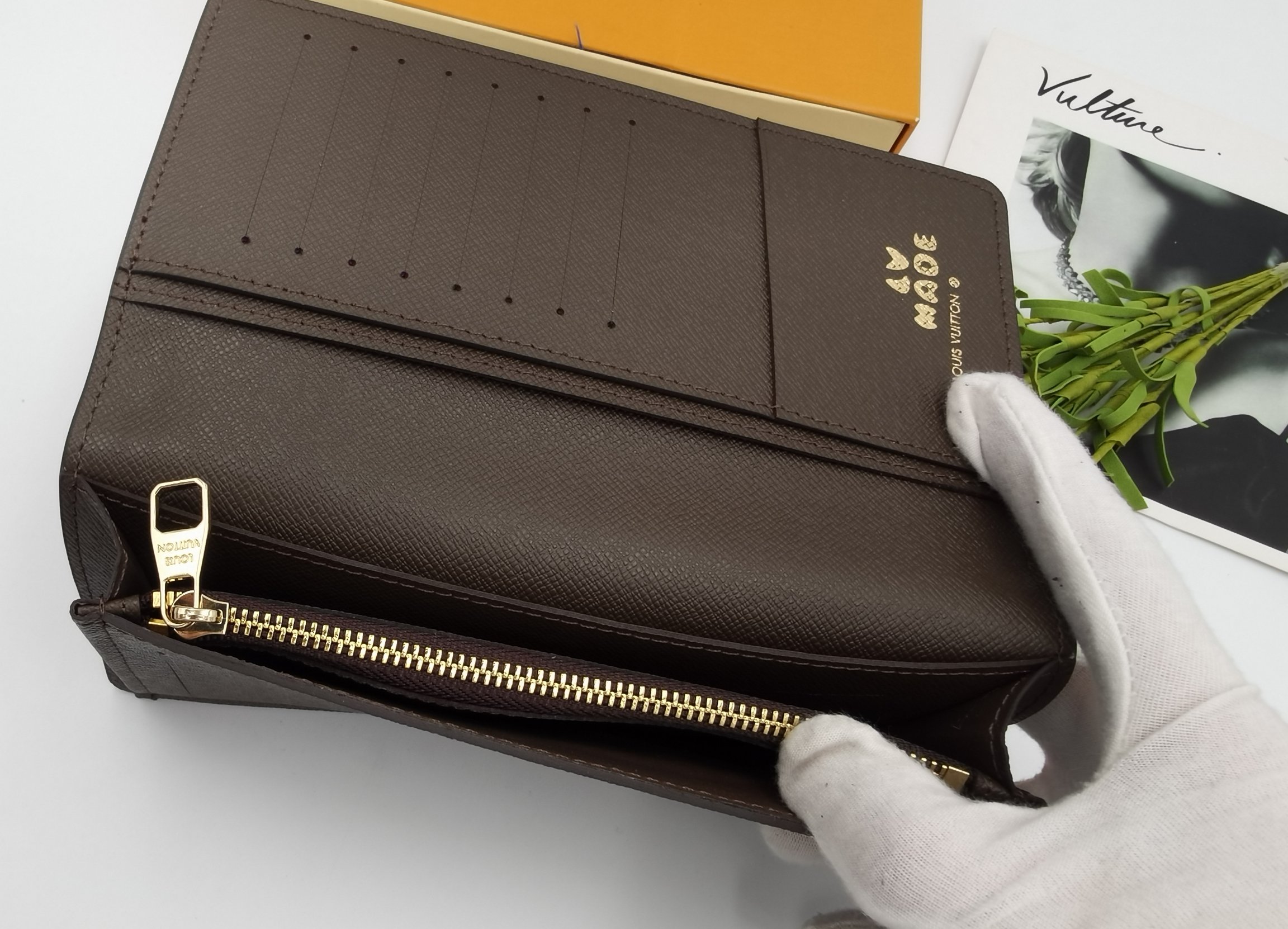 Wallet in use with cash and cards