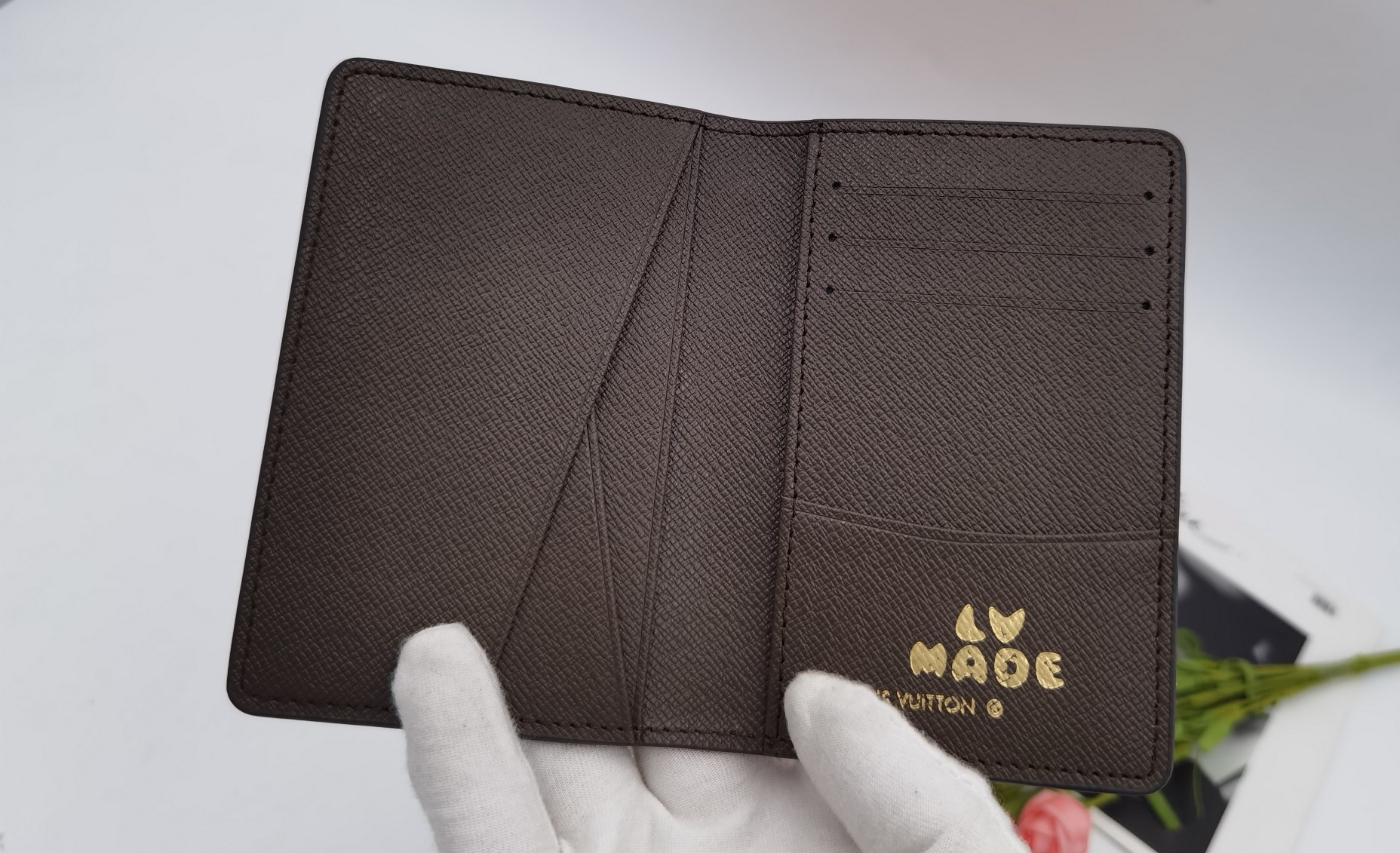 Hand holding luxury leather card holder