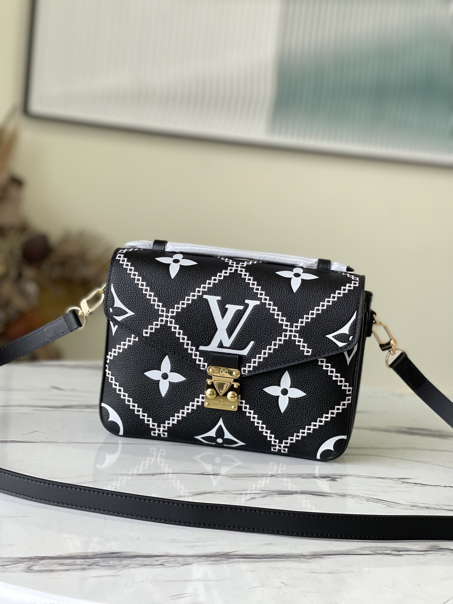 Louis Vuitton Pochette Métis Monogram Empreinte Leather in Black - WOMEN - Handbags M46028
