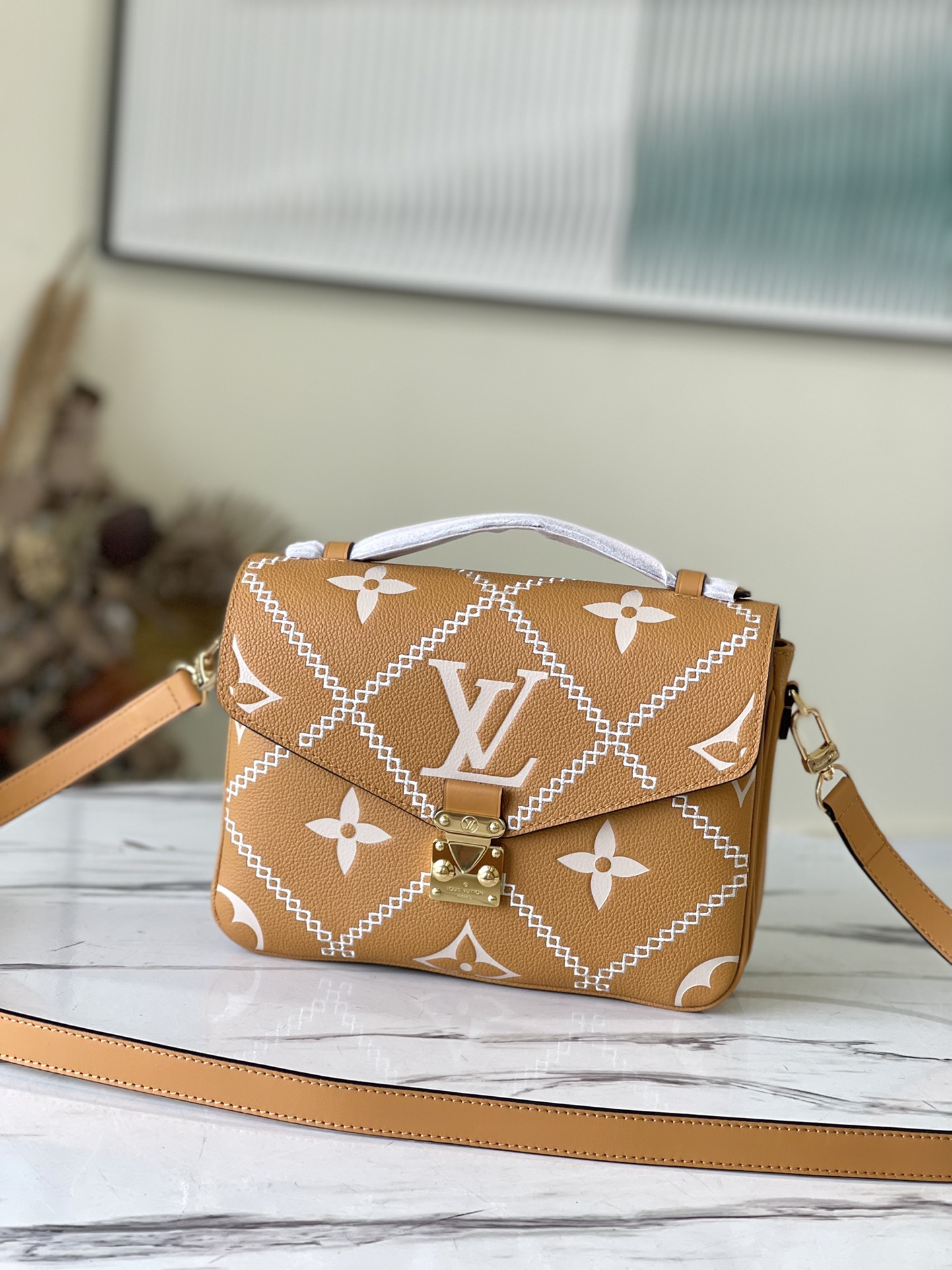 Louis Vuitton Pochette Métis Monogram Empreinte Leather in Brown - WOMEN - Handbags M46018