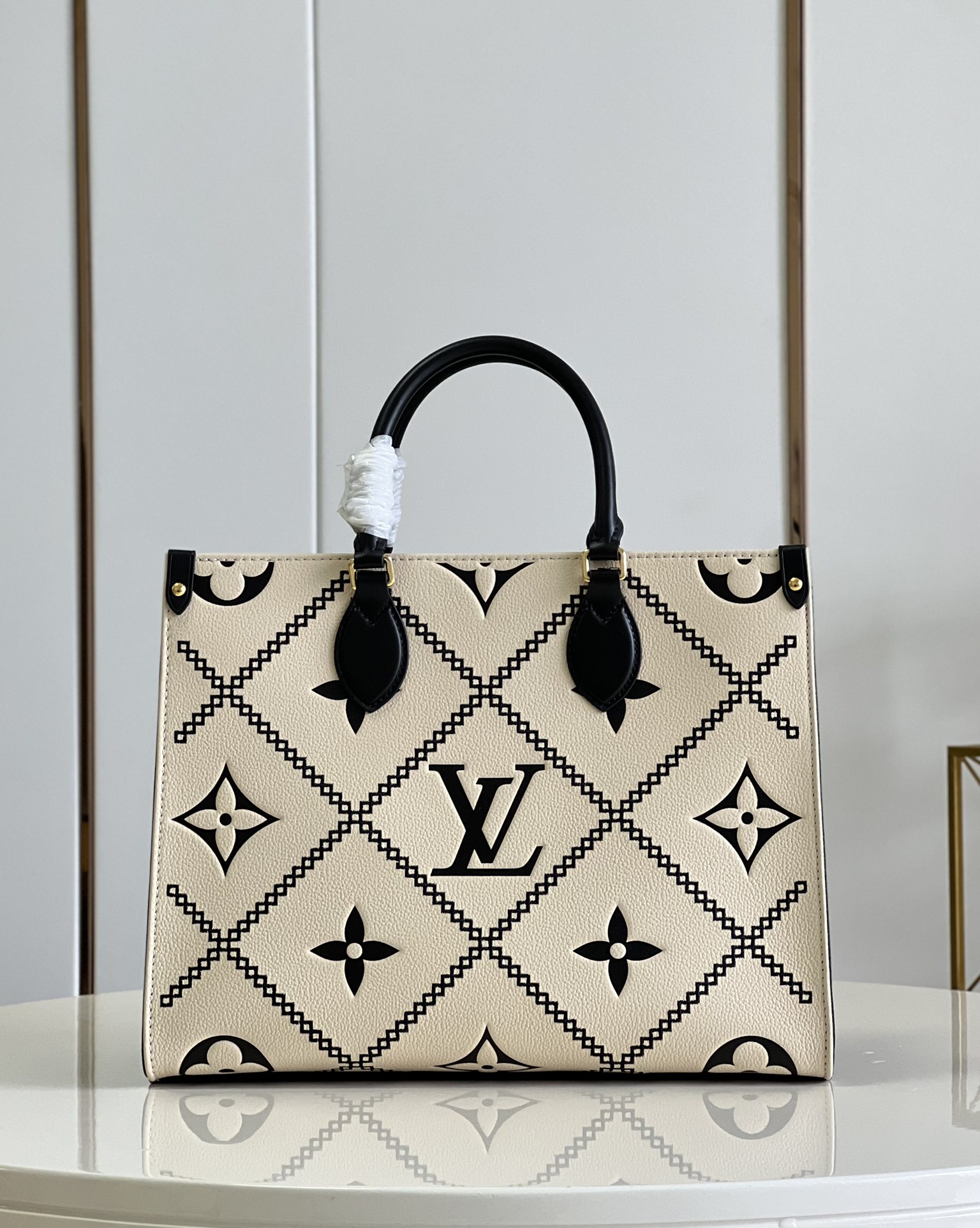 Louis Vuitton OnTheGo MM Monogram Empreinte Leather in Cream - WOMEN - Handbags M46016