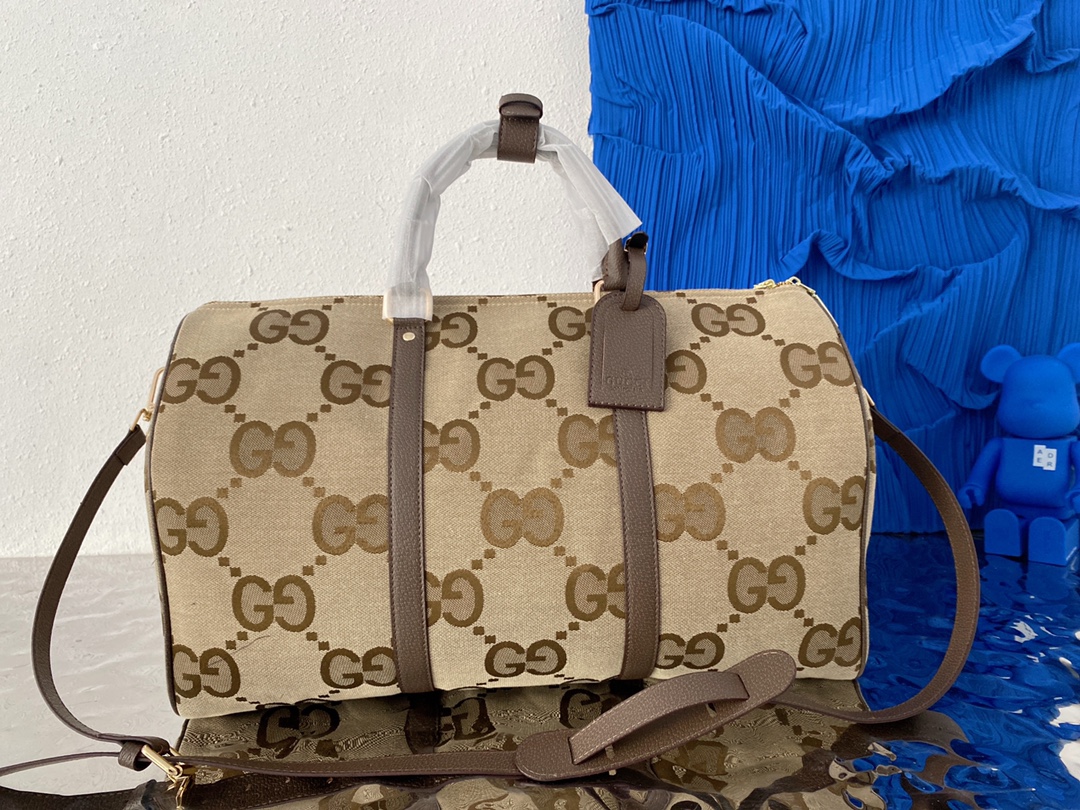 Gucci 古奇   GG 帆布旅行袋 机场包 行李包 手提包袋 休闲百搭 采用精湛镶嵌细工，实物拍摄 原厂原版面料 配送小票防尘袋 50 x 29 cm。