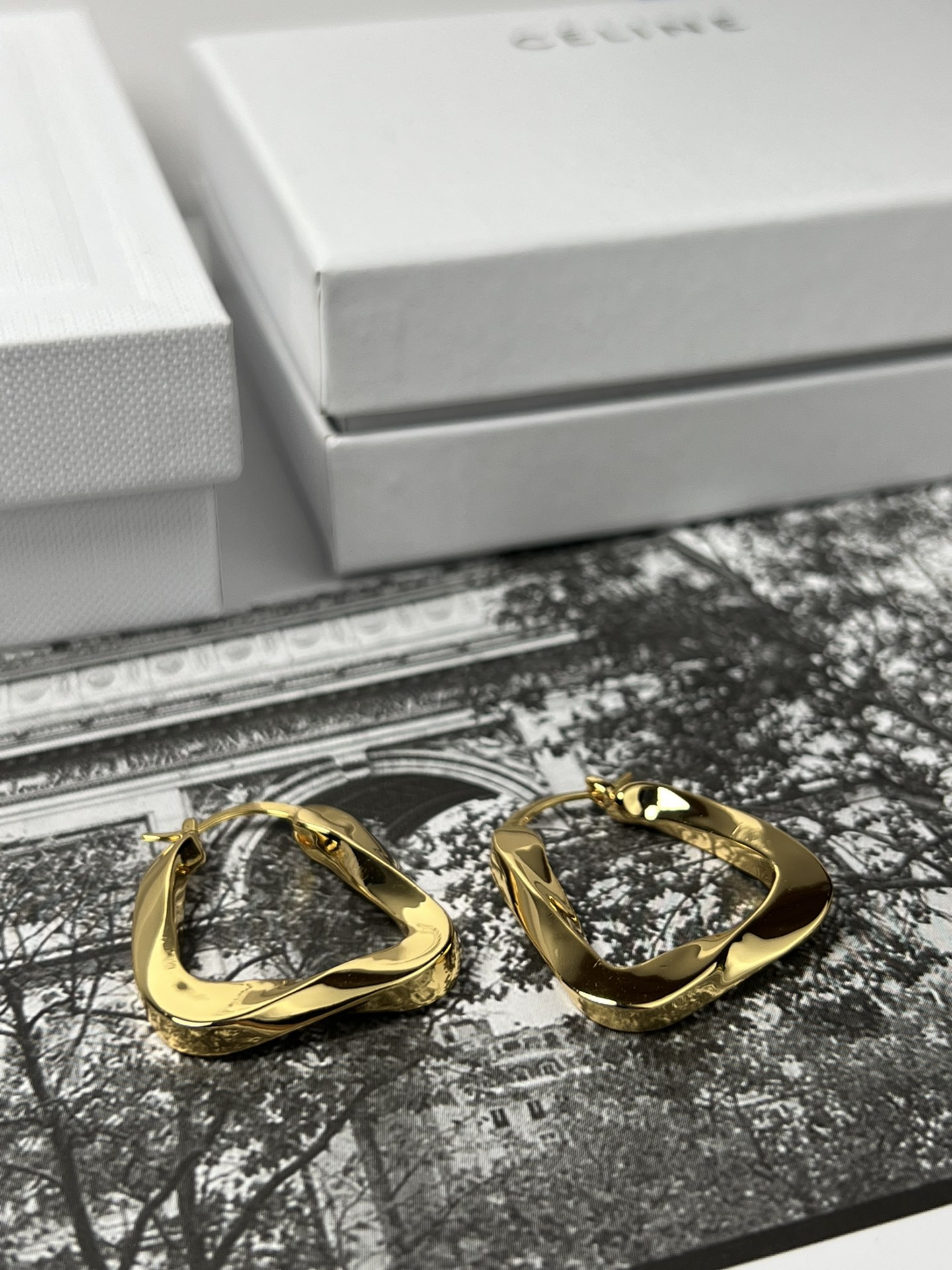 Celine YHEH055 Twisted Square Hoop earrings polished gold tone metal no accent stones 2 5cm hoop diameter
