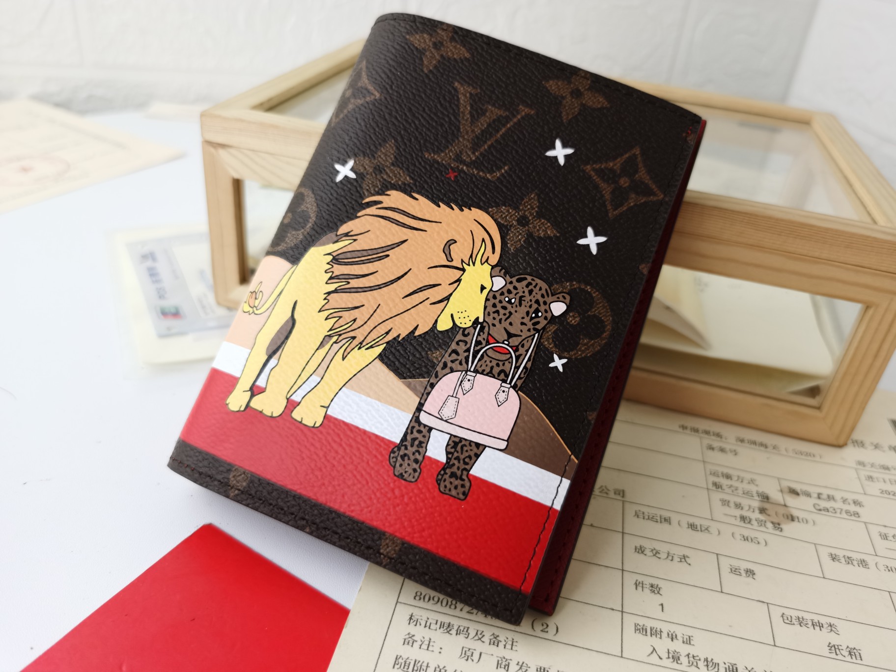 Leather passport case, opened with a passport inside.