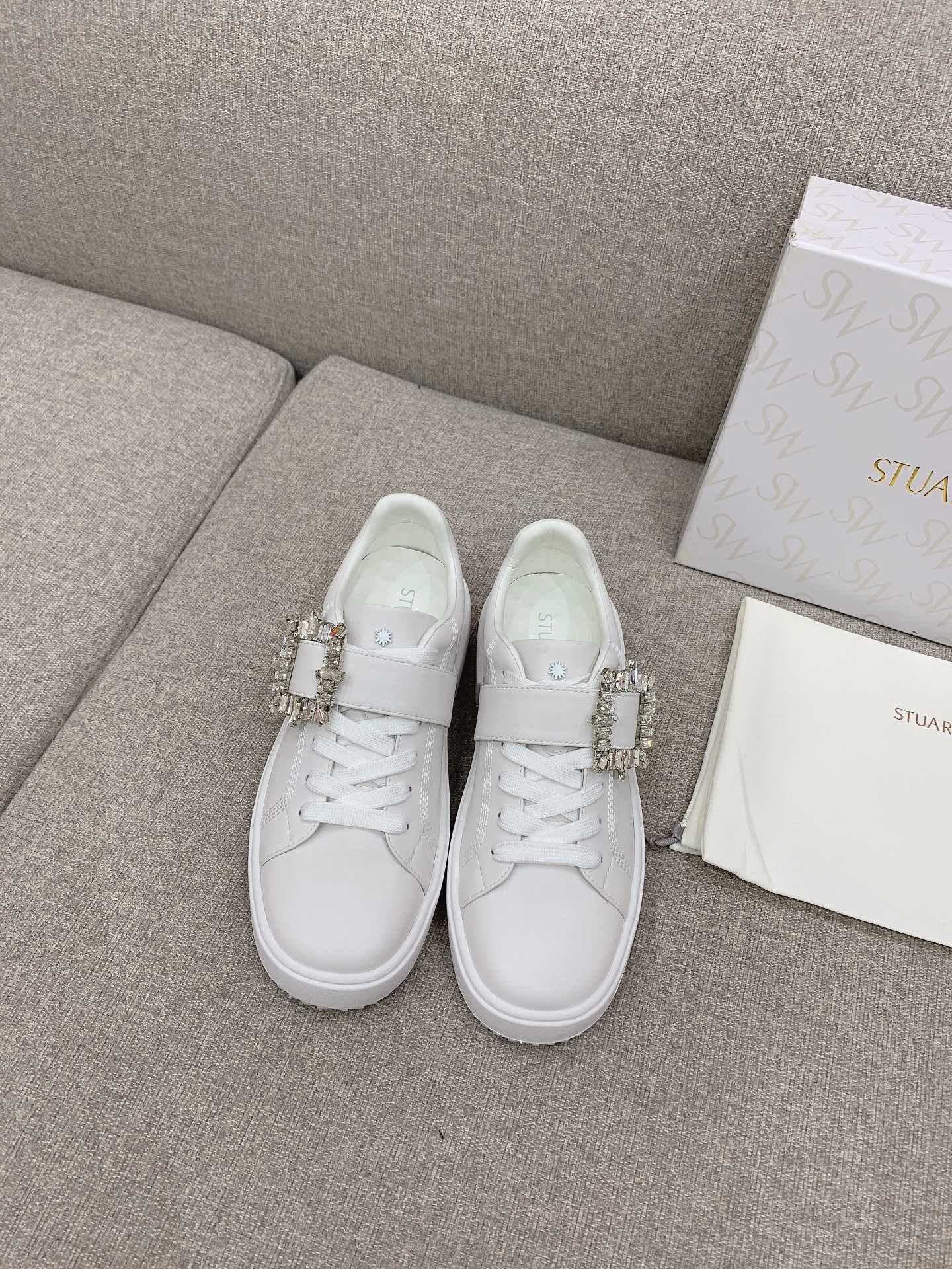 Stylish Stuart Weitzman White Shoes with Fine Details for Plant Workers.