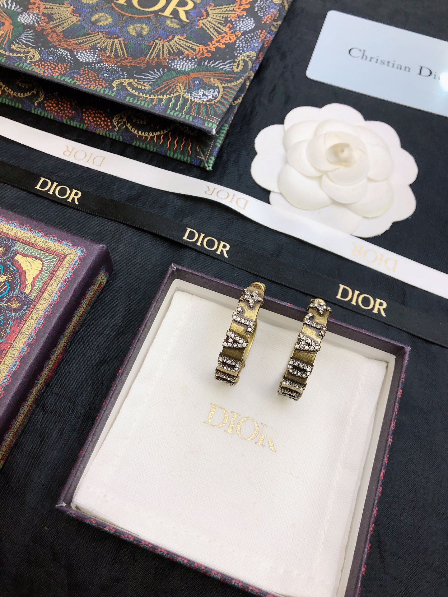 dior gold black stripe huggie hoop earrings