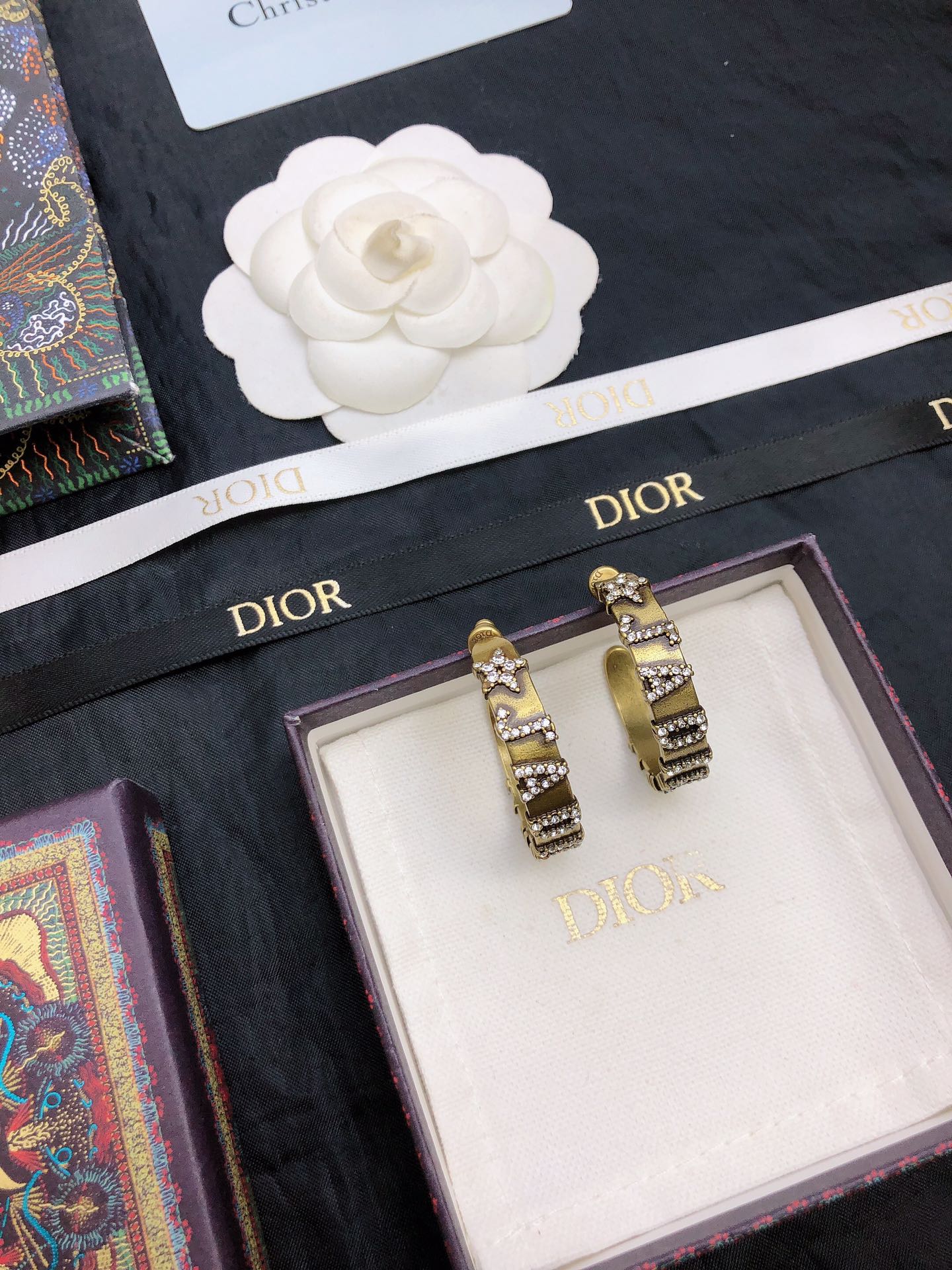 dior gold black stripe huggie hoop earrings