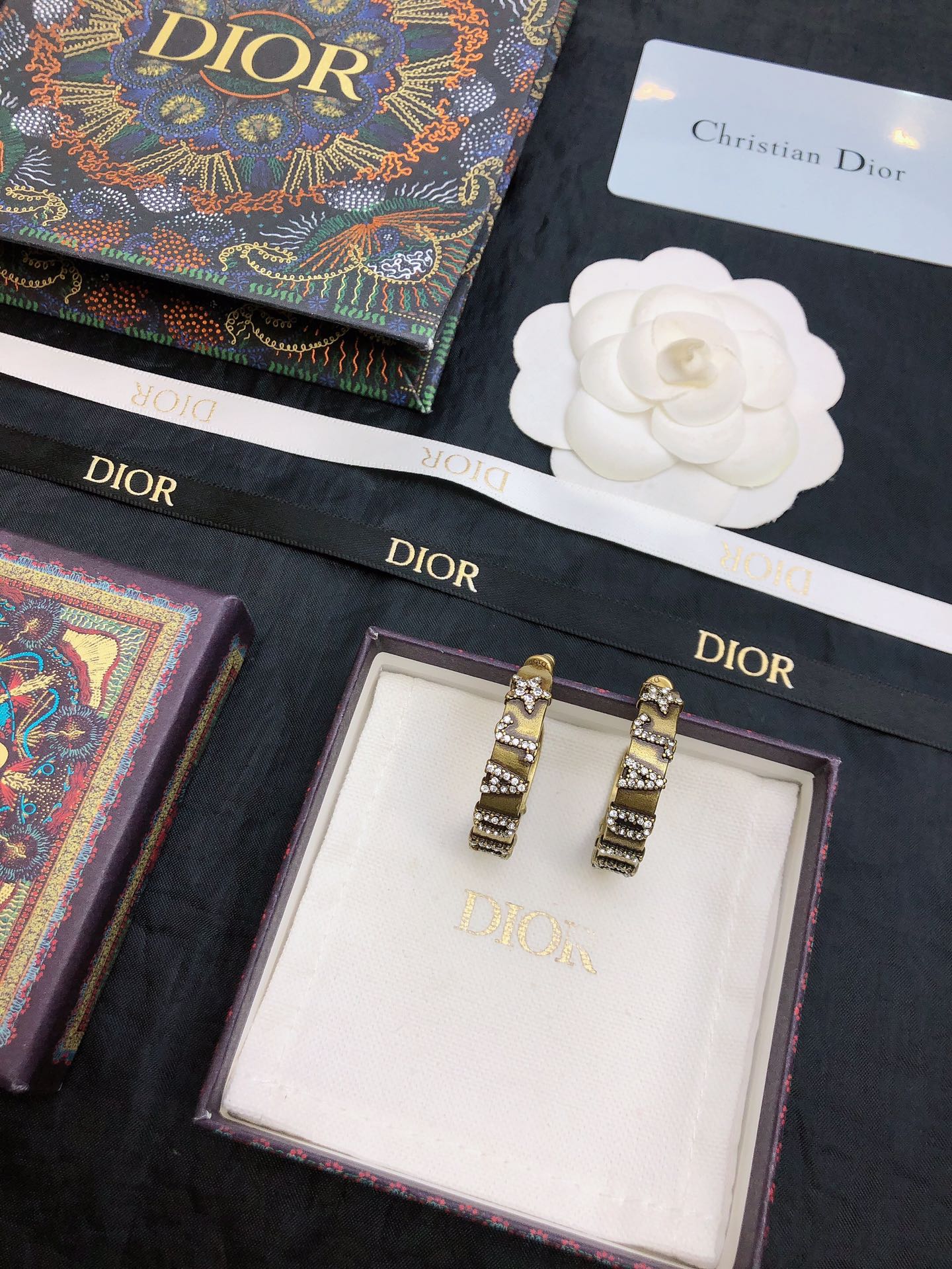 dior gold black stripe huggie hoop earrings