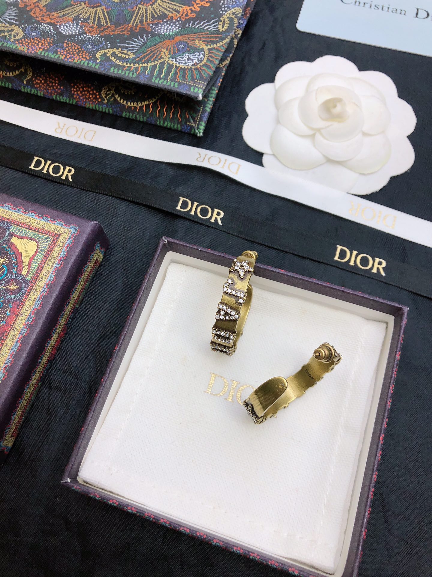 dior gold black stripe huggie hoop earrings