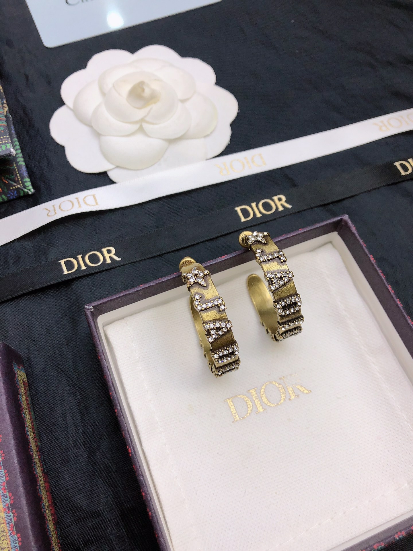 dior gold black stripe huggie hoop earrings