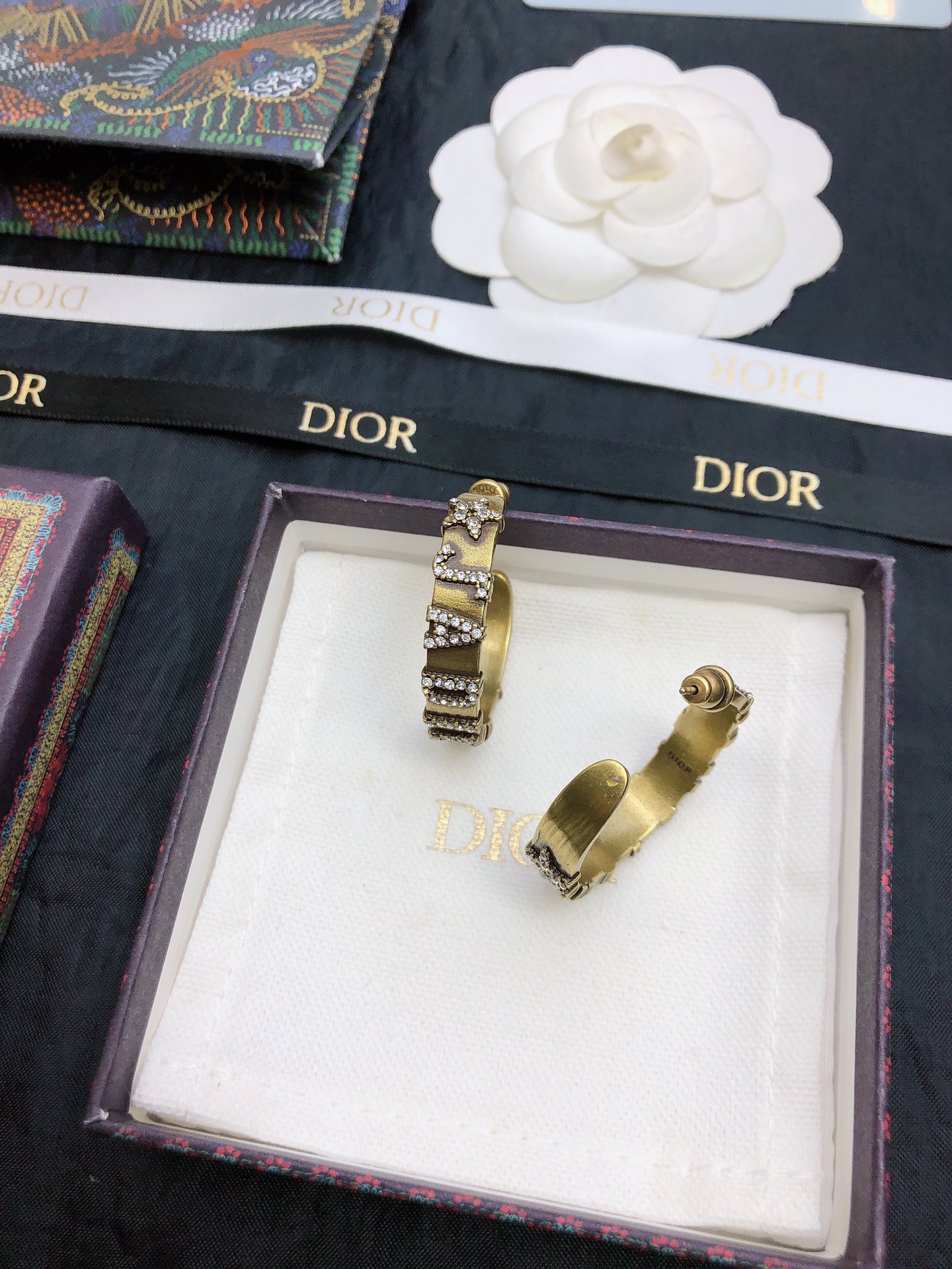 dior gold black stripe huggie hoop earrings