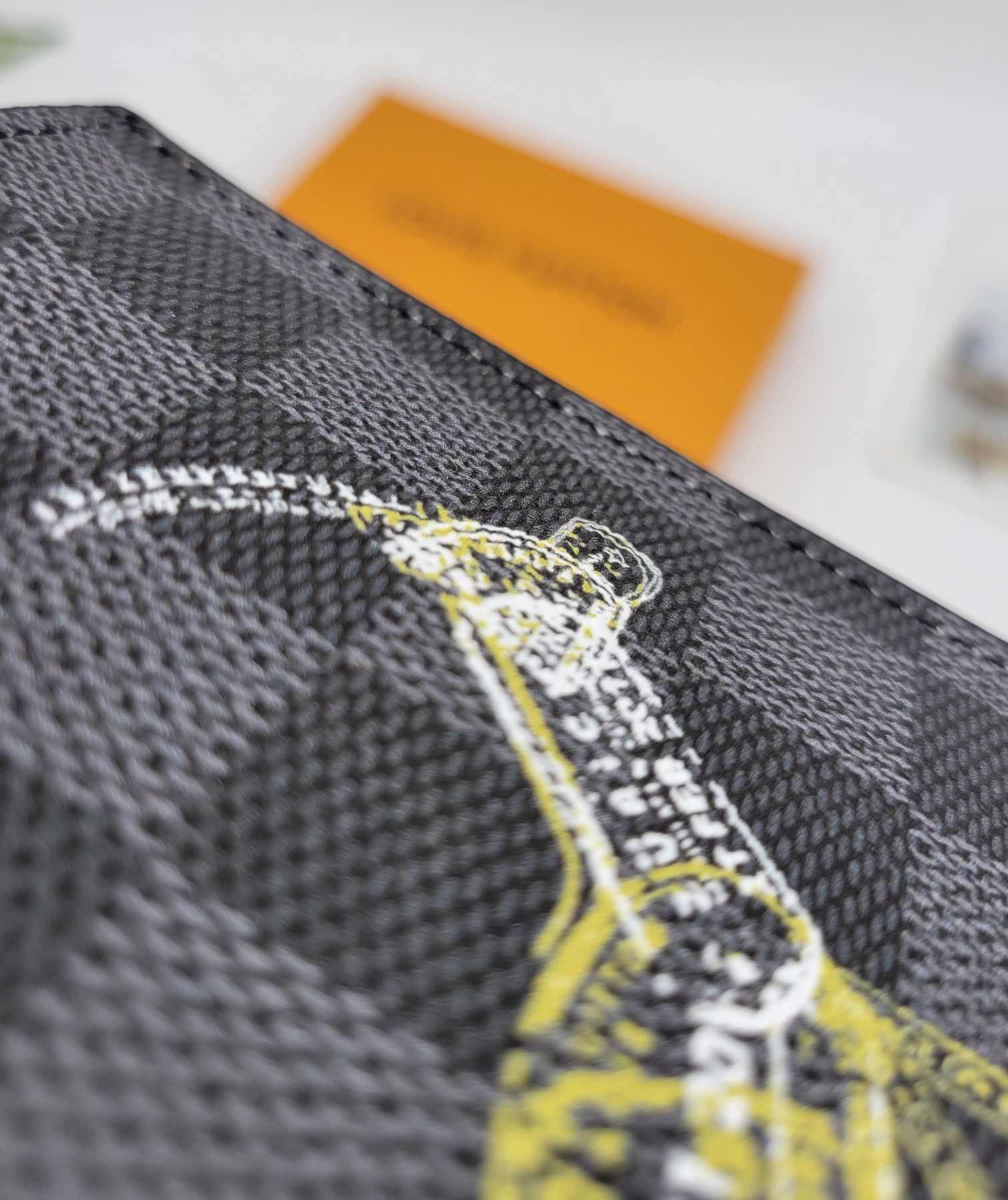 Passport holder in use, held by a hand