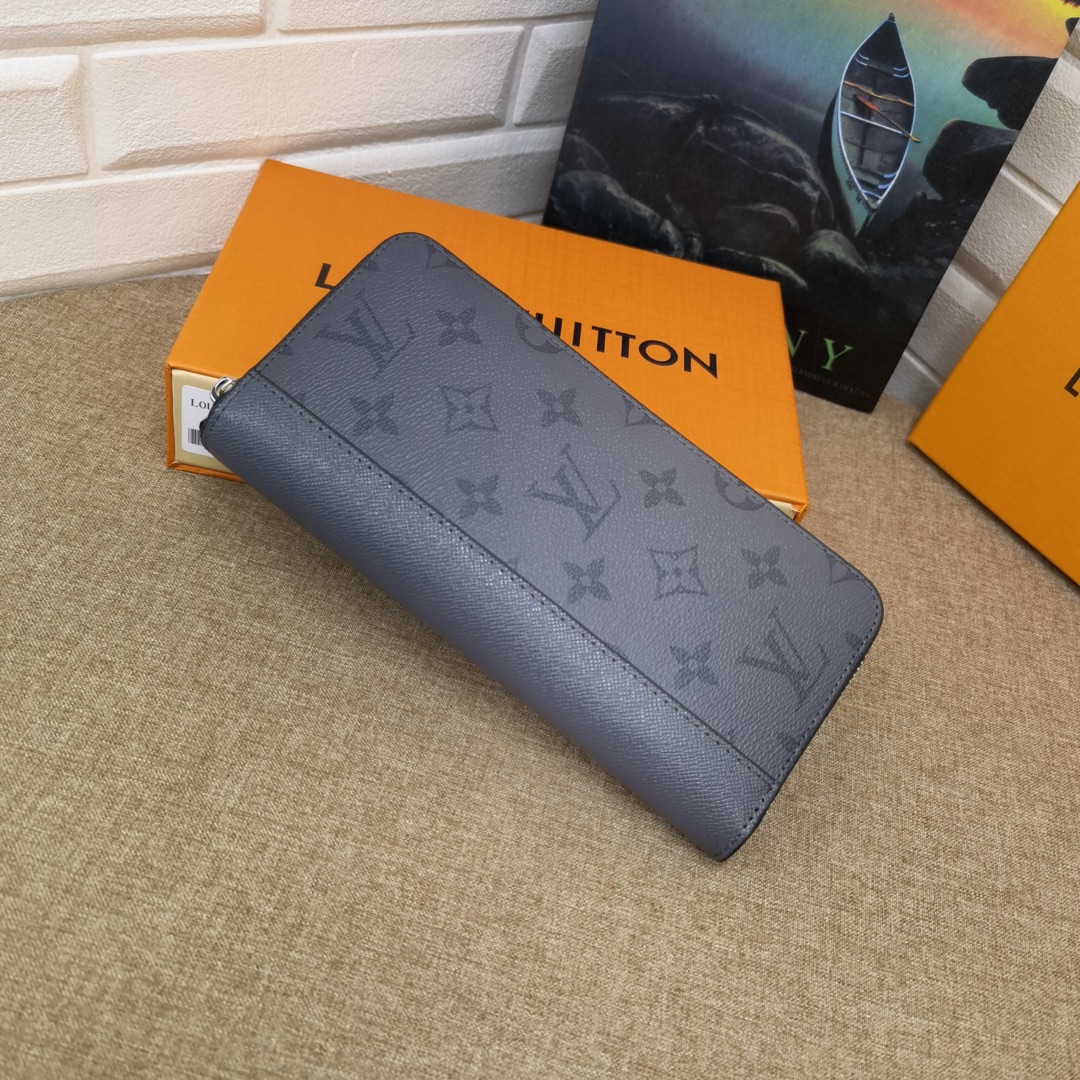 Open view of the long leather wallet showing compartments