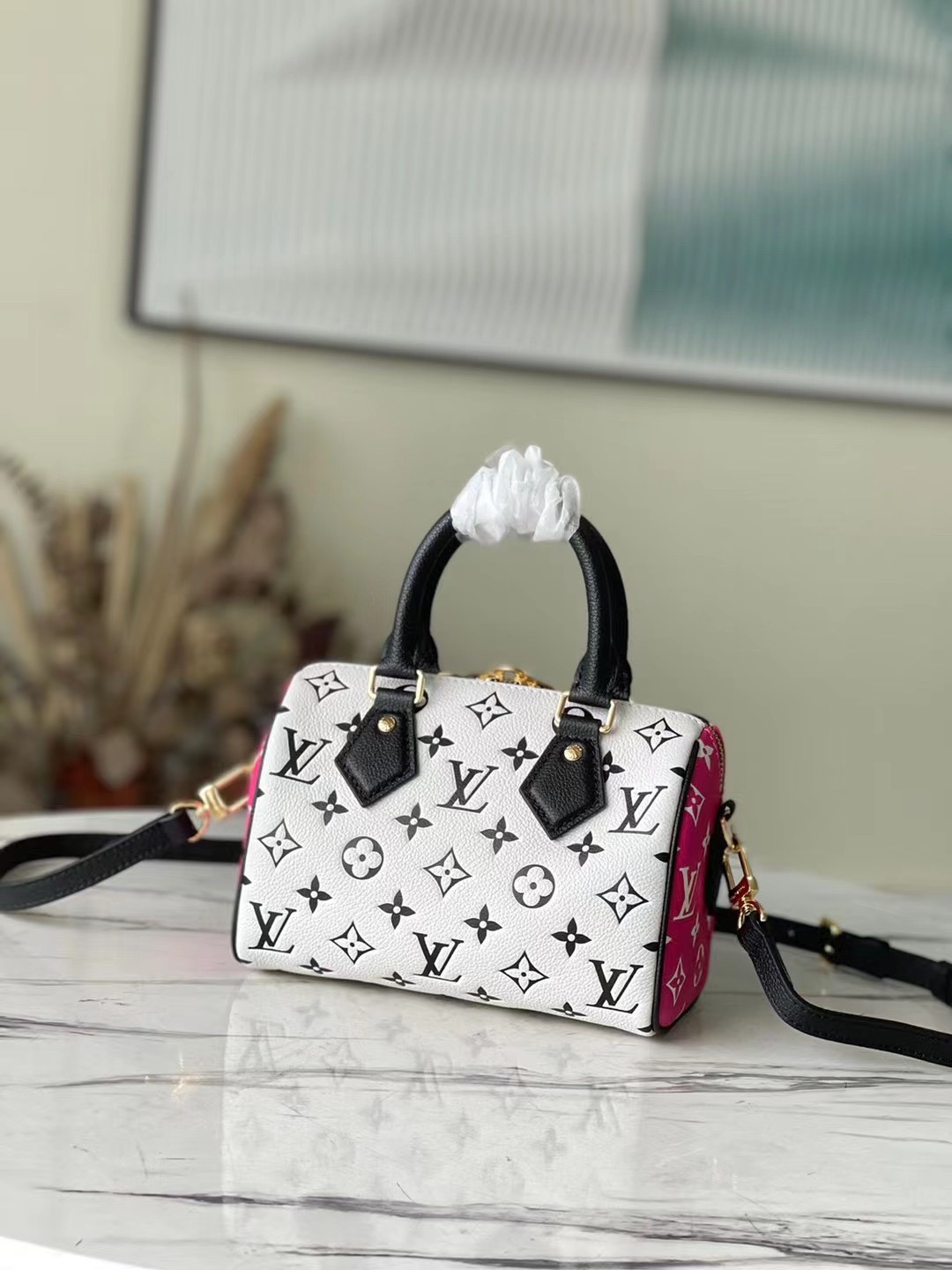 this Speedy Bandoulière 20 handbag features a pattern that is first - Bag 3