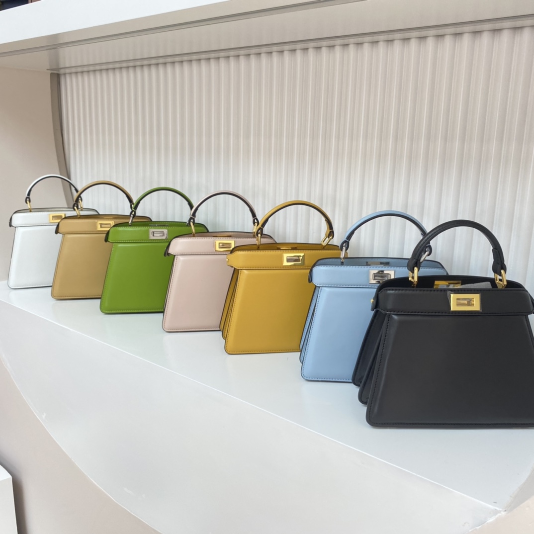 Fendi FEND1's iconic Peekaboo ISeeU handbag, small and cute. Made of soft nappa leather with classic twist locks on the sides. The lined interior