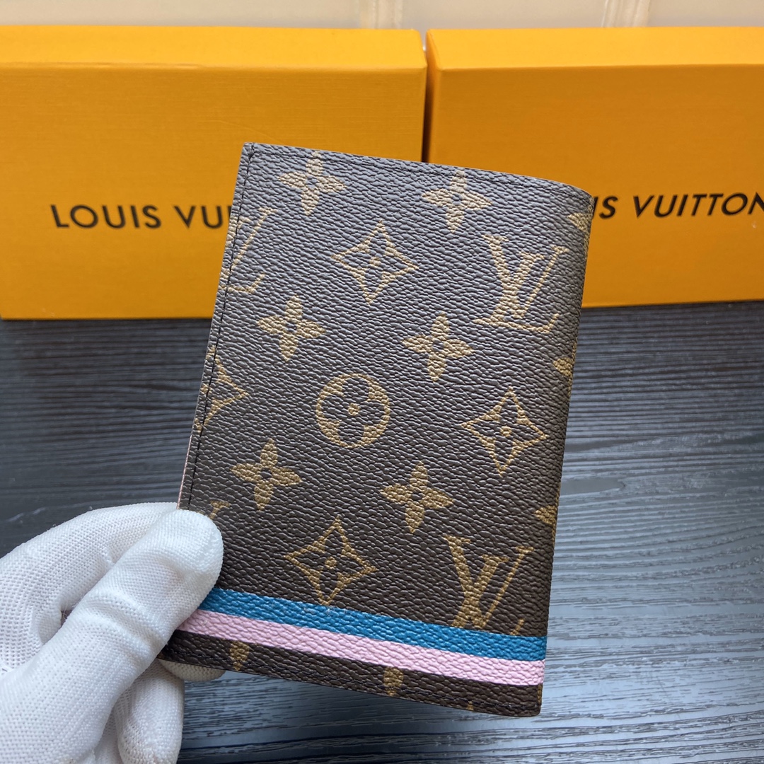 Person holding a passport holder.