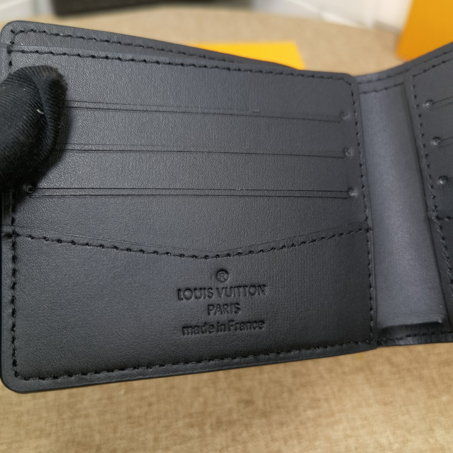 Classic Bifold Leather Wallet - next to a credit card for size comparison