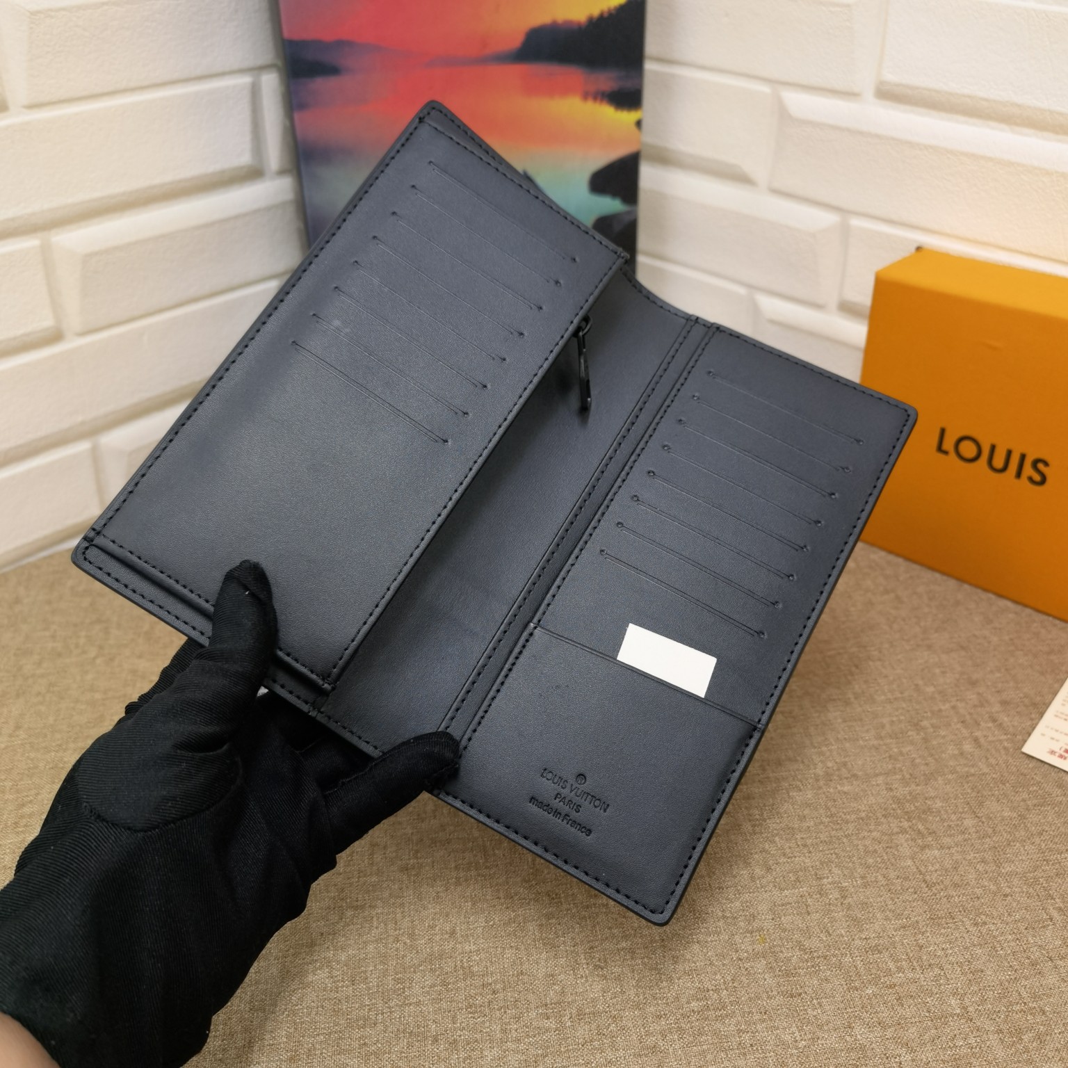 Bifold wallet in hand size comparison