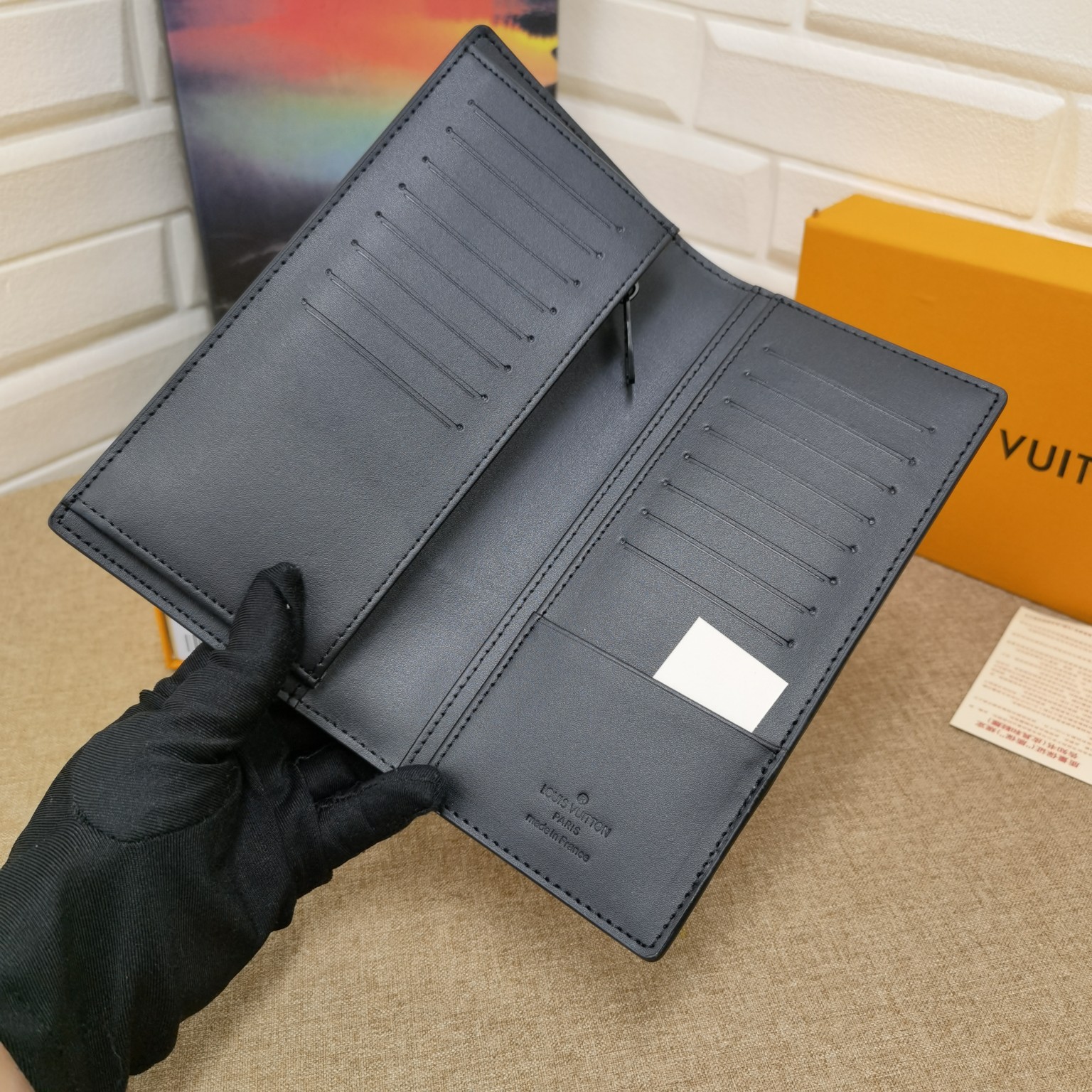 Bifold wallet in hand size comparison