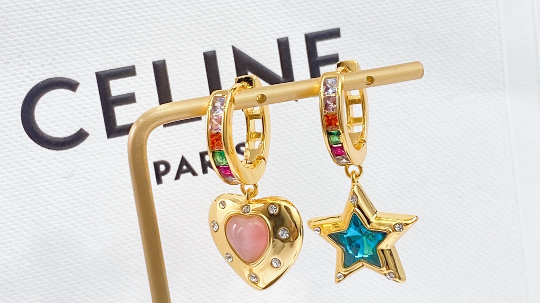 Celine Asymmetric Heart Star Rainbow Crystal Huggie Earrings earrings Gold-tone metal with multicolor rainbow crystals pink opal-style heart stone blue crystal star and clear accent crystals 12mm hoop diameter 20mm total drop length