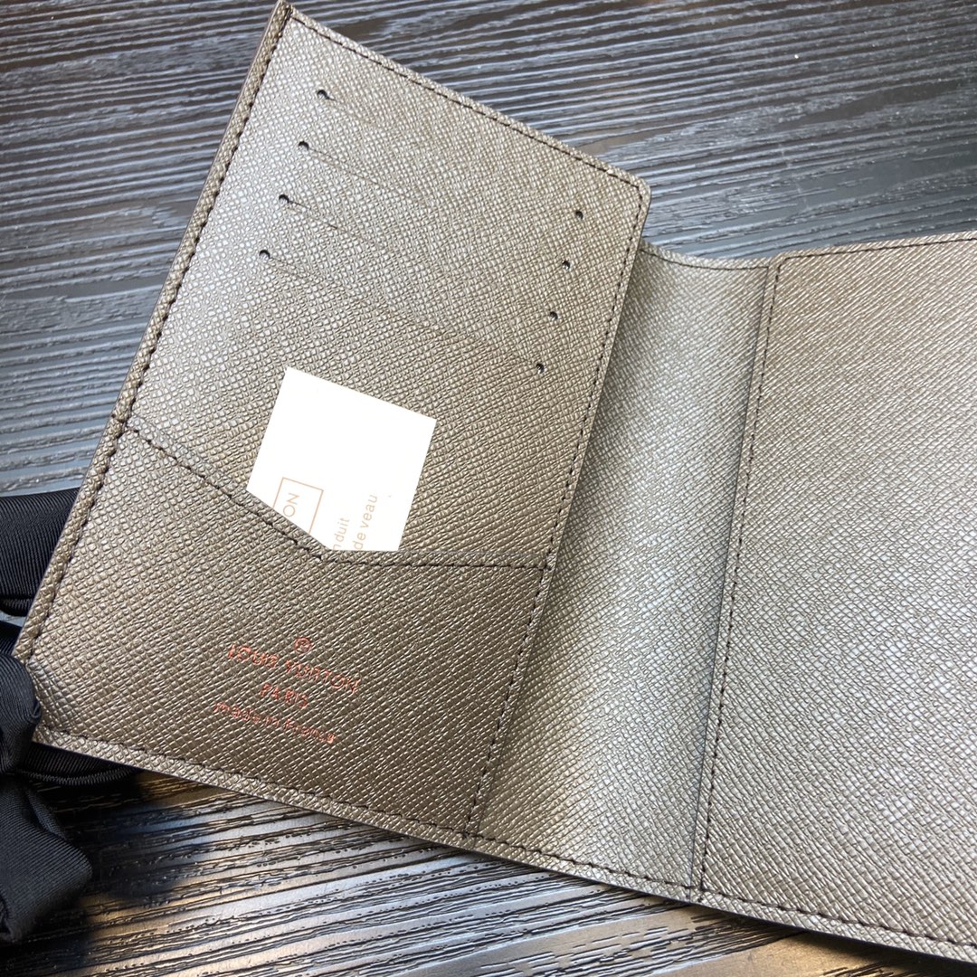 Embossed logo on the passport case.
