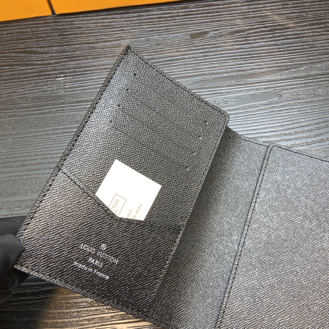 Engraved initials on a leather passport holder