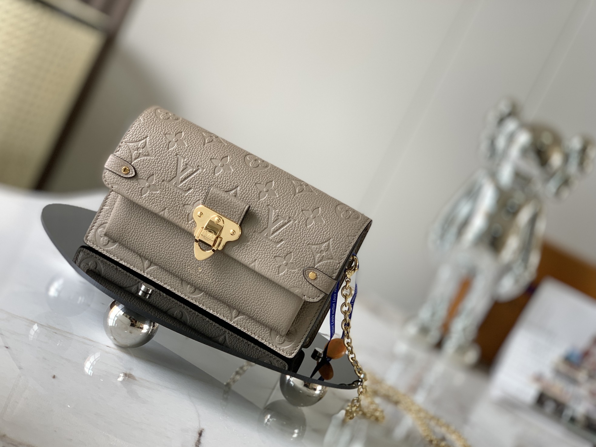 Louis Vuitton LV Vavin Crossbody & Shoulder Bags Elephant Grey Gold Empreinte​ Cowhide Chains M69423