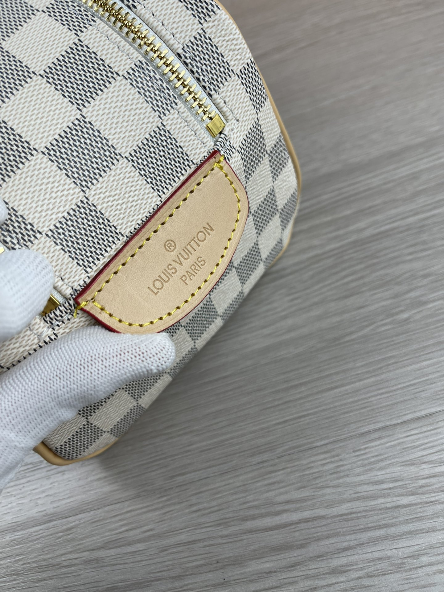 White Cosmetic Bag M47528 - Interior with Water-Resistant Lining White cosmetic bag interior with water-resistant lining