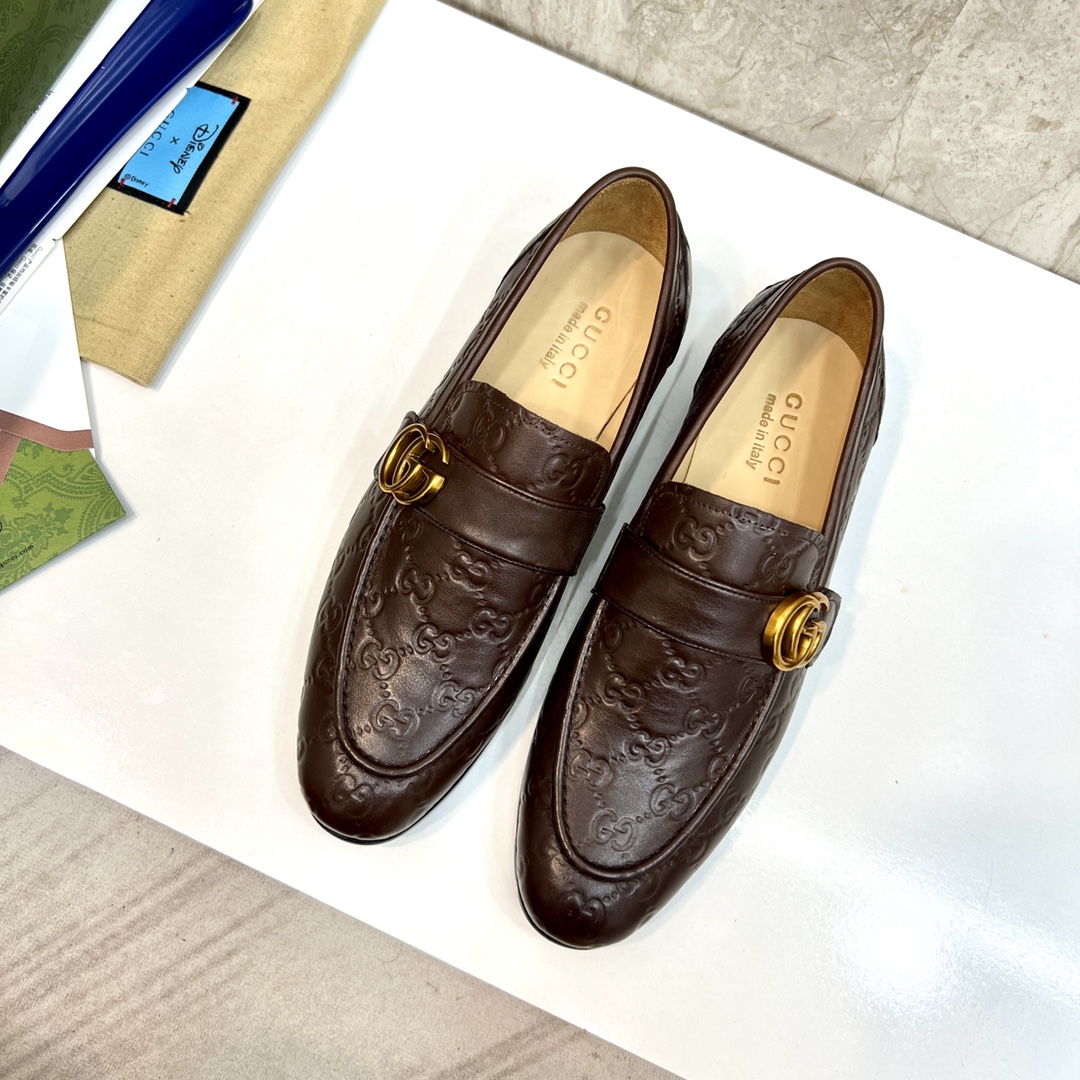 Gucci Men's Brown Leather Loafers with Embossed GG Pattern and Gold-Tone Hardware