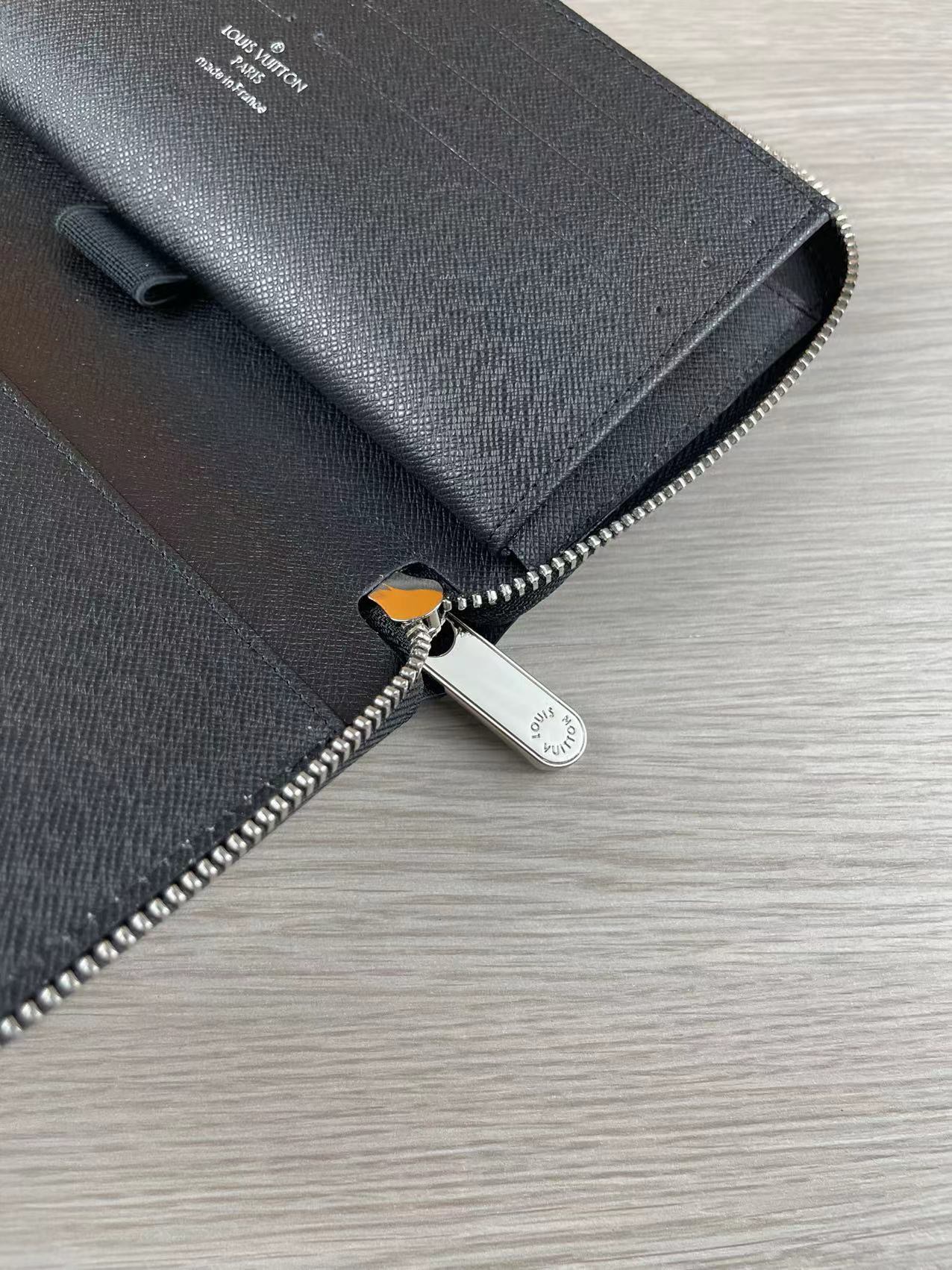 Leather zip wallet on desk