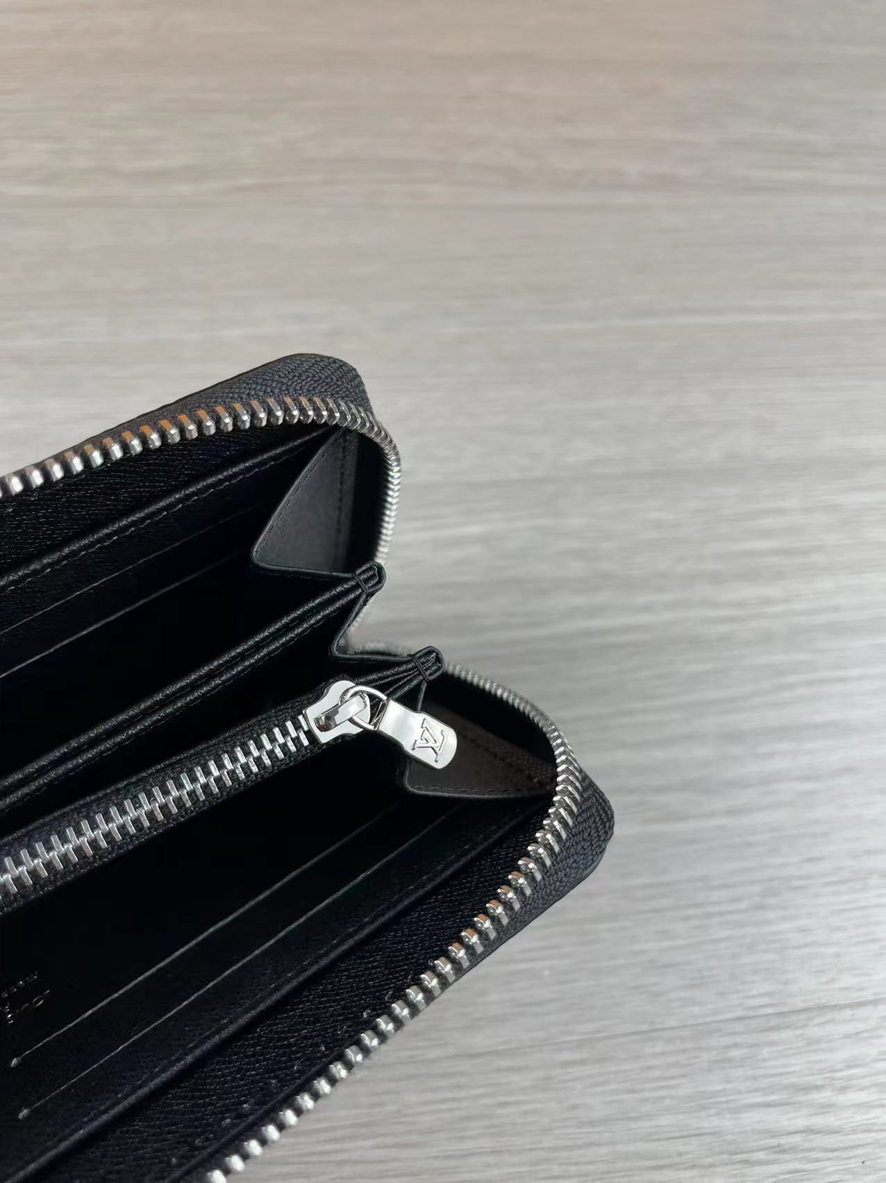 A person holding the genuine leather long wallet.