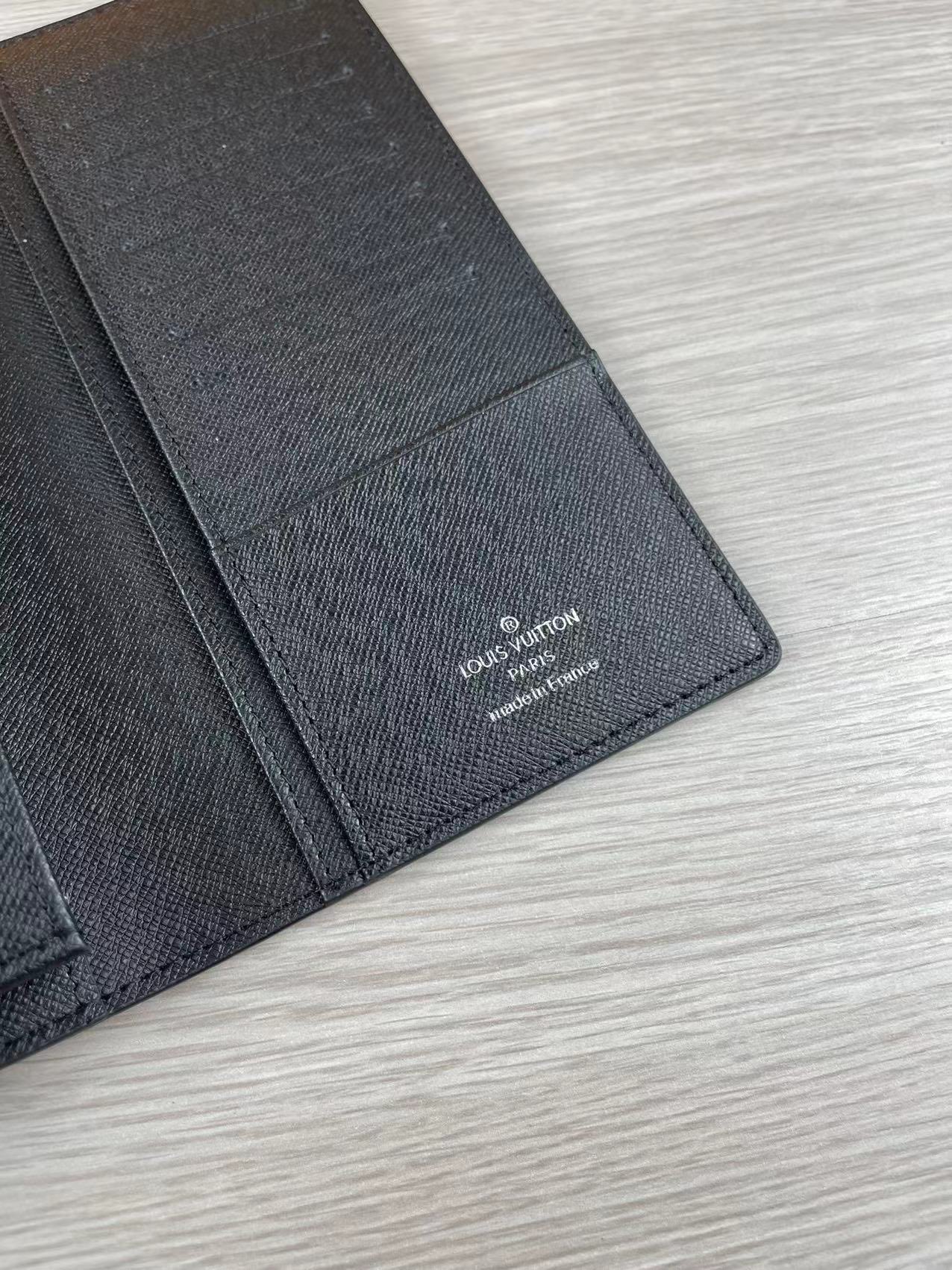 Bifold wallet open with cash and cards