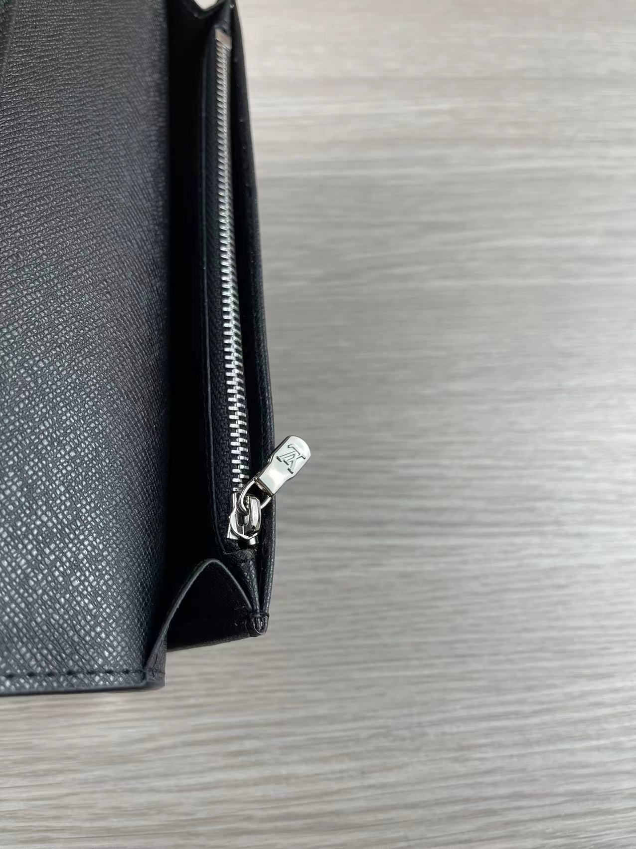 Genuine leather wallet in hand