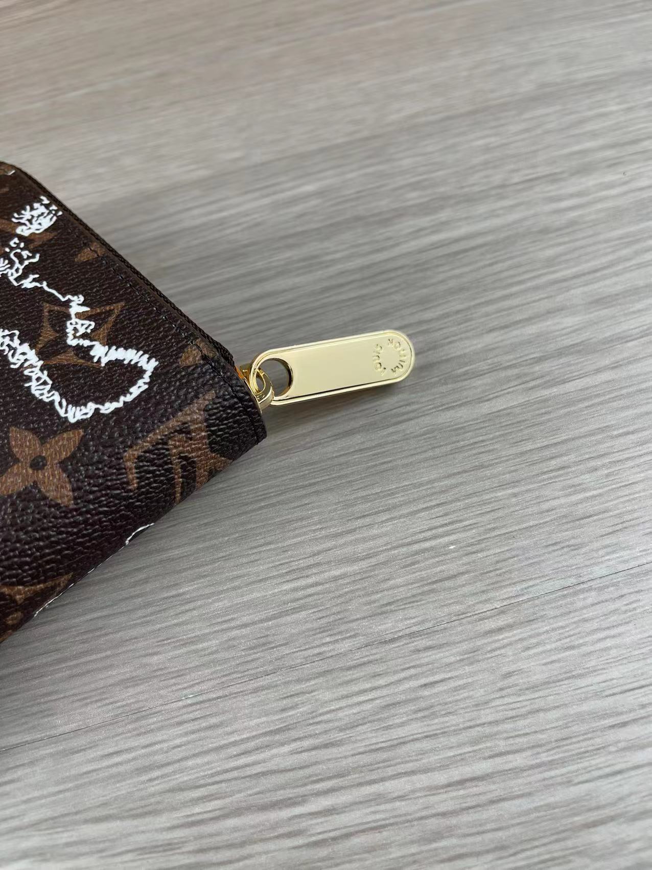 Leather wallet showing secure zipper.