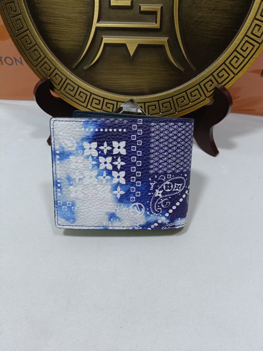 Leather bifold wallet open with card slots and bill compartment