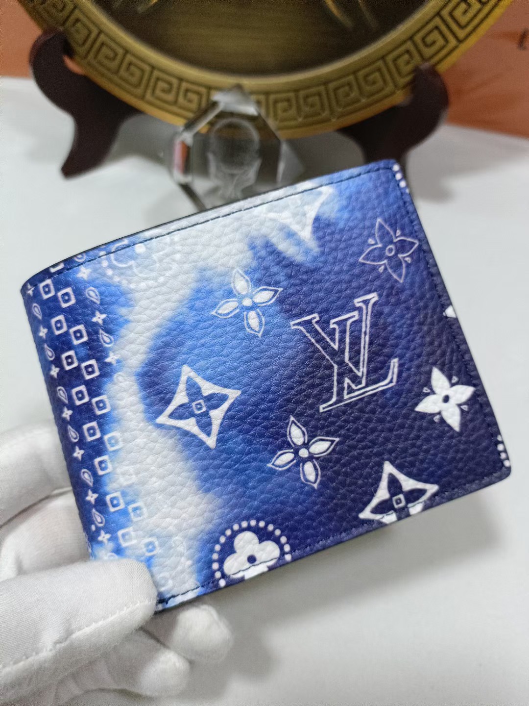 Side profile of the leather bifold wallet showing its slim profile.