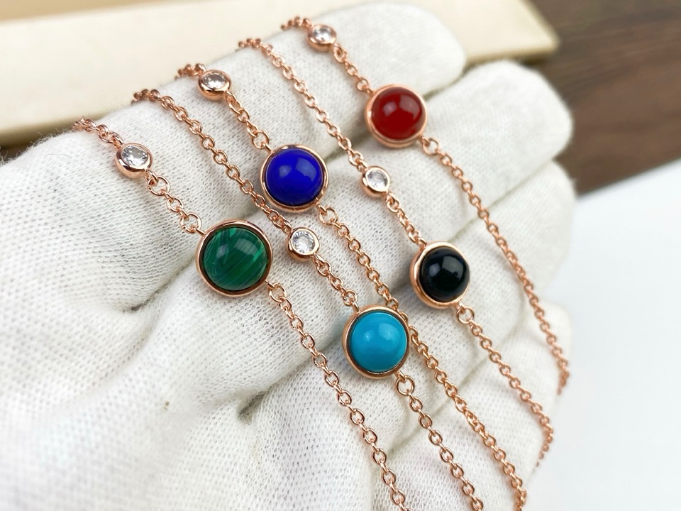 Title: P225 Count Possession Bracelet with Radiant Diamond and Gemstones Summary: Elegant bracelet with black, green, and boulder beads, adorned with a radiant diamond in 18k