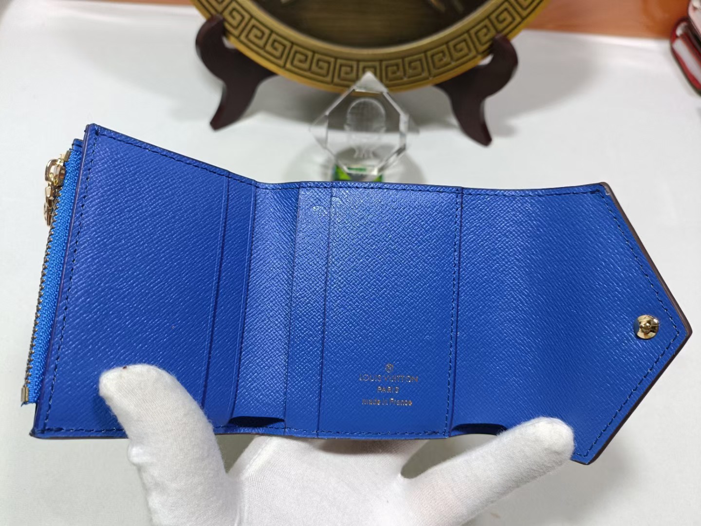 Leather wallet being held in hand