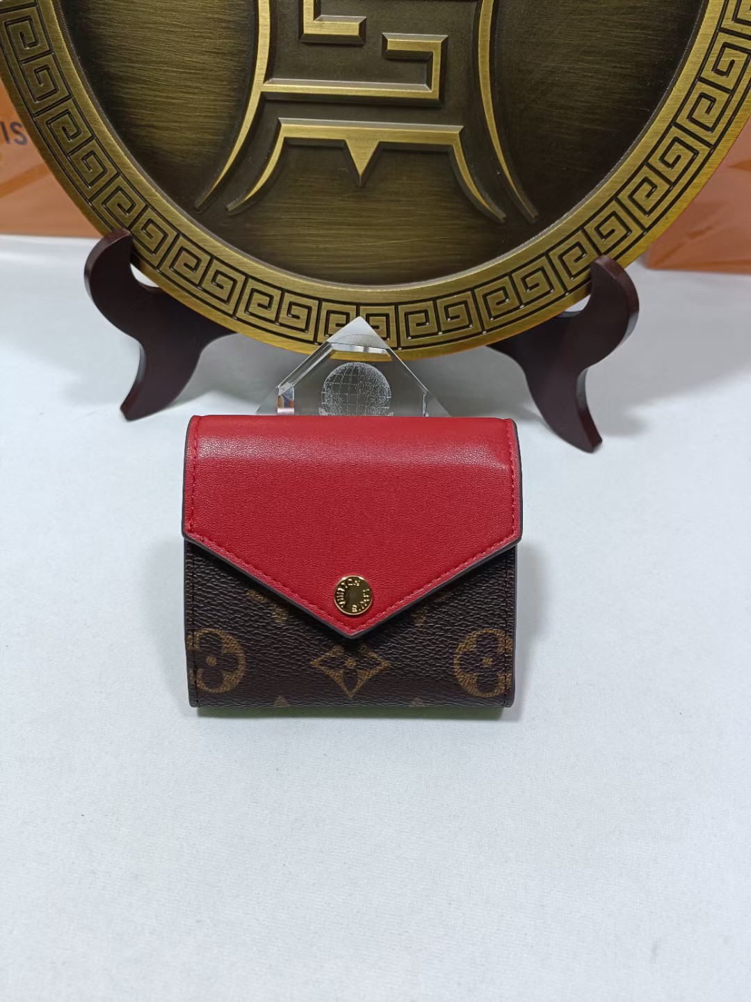 Genuine leather bifold wallet, front view, showing texture