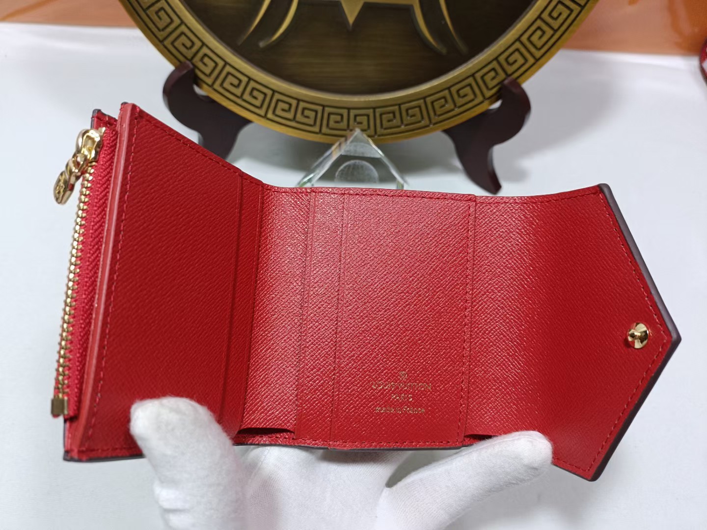 Leather wallet being held in hand
